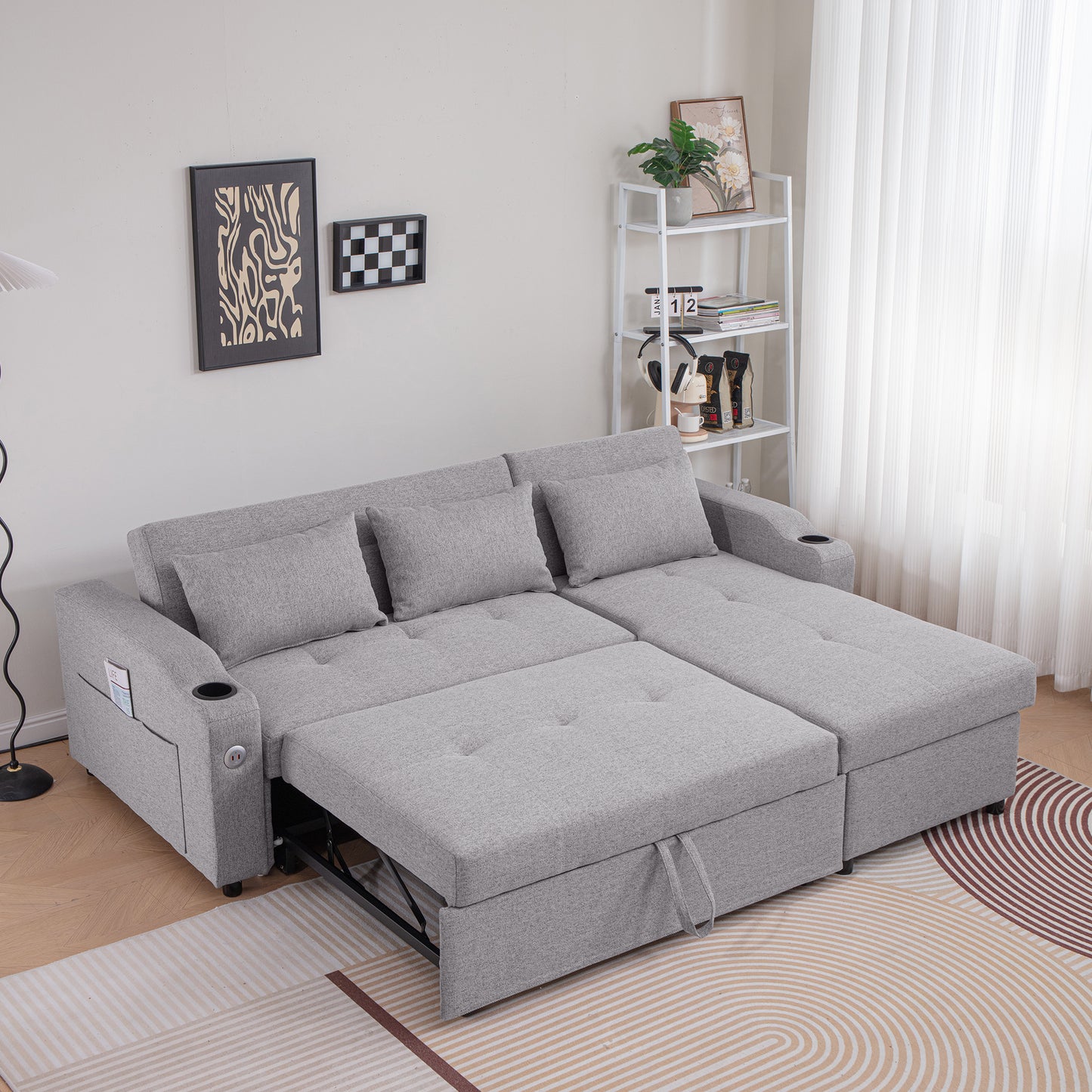 Gray fabric sectional sofa bed with pullout chaise and cup holder