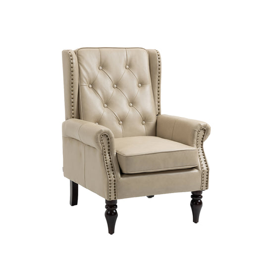 Tufted beige leather armchair with nailhead trim and dark wood legs