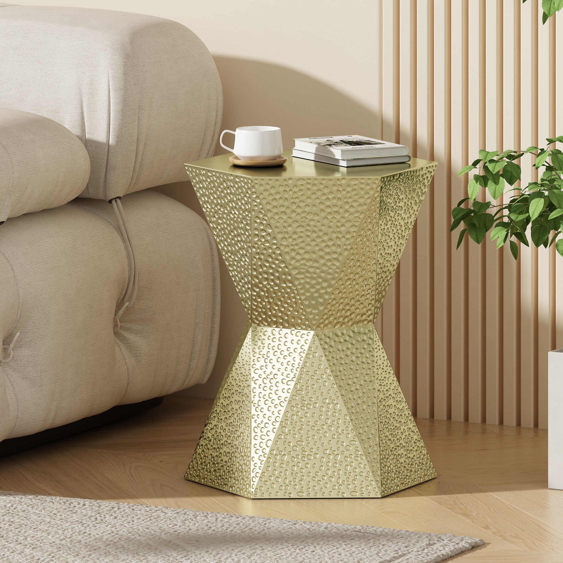 Glamorous gold hourglass accent table with hammered finish and geometric design perfect for modern living rooms