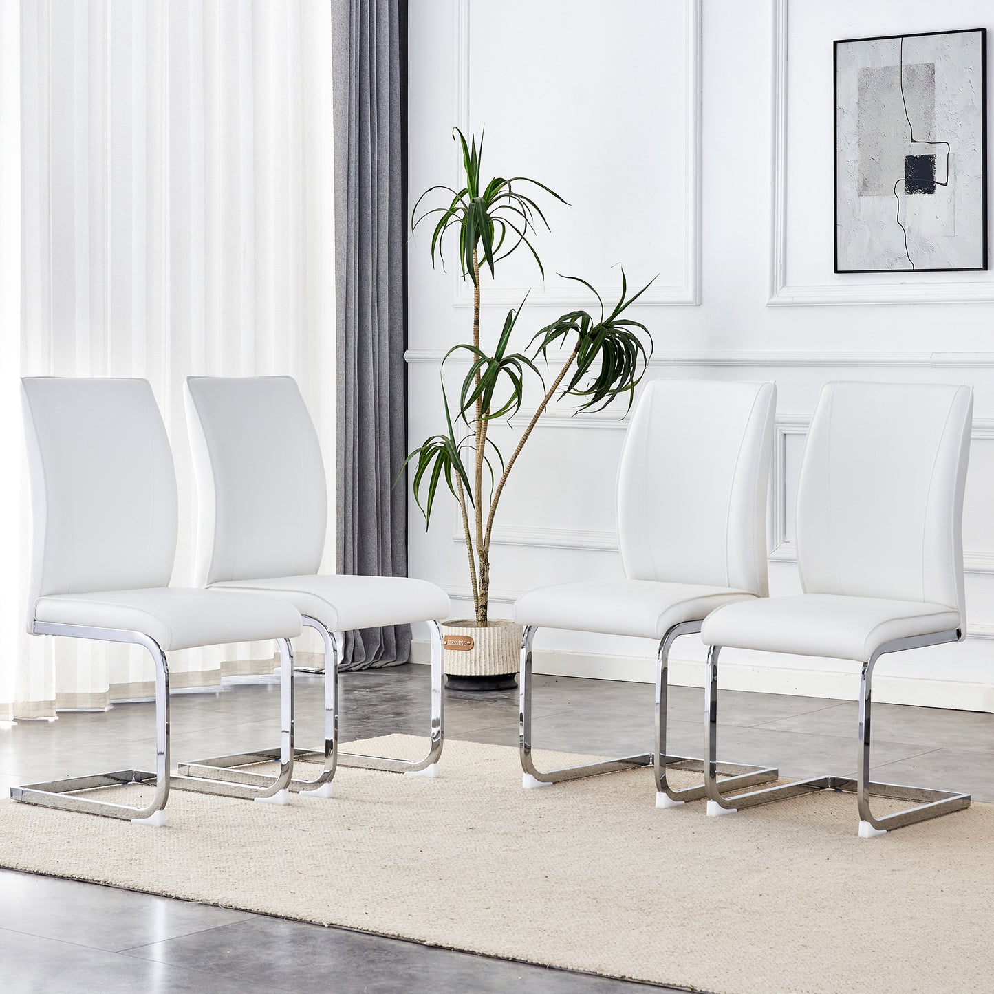 Set of four white faux leather dining chairs with chrome sled bases
