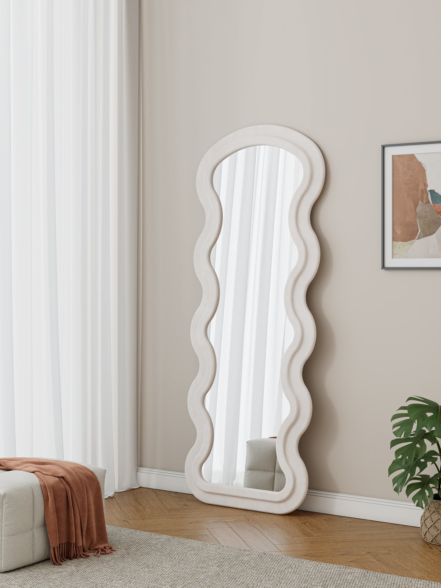 Wavy abstract floor mirror with a textured cream frame reflecting sheer curtains