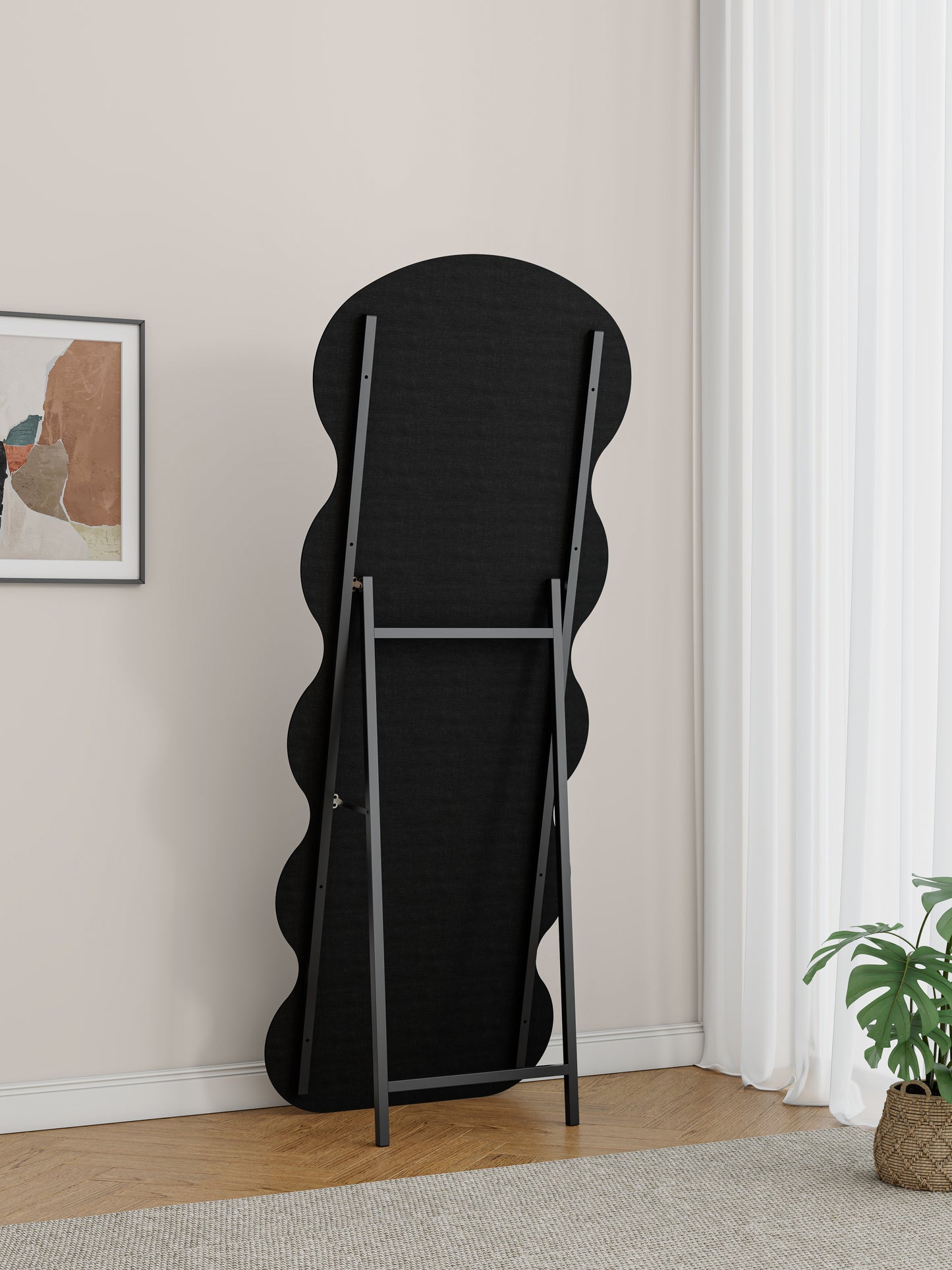 Back view of a black wavy fulllength mirror with a metal stand