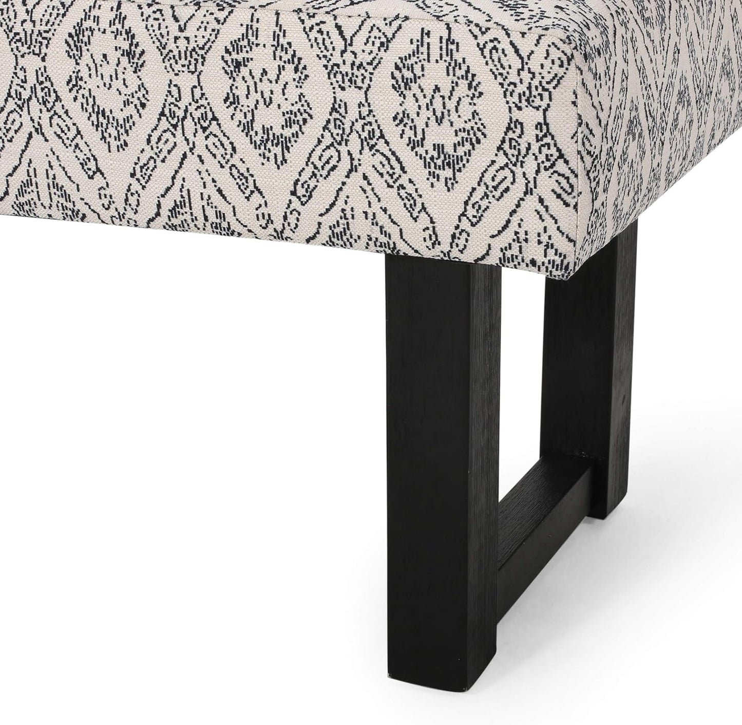 Cream accent bench with intricate black diamond pattern upholstery and dark wood legs