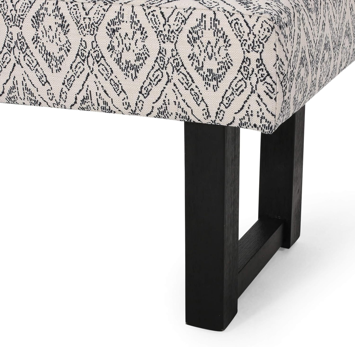 Cream accent bench with intricate black diamond pattern upholstery and dark wood legs