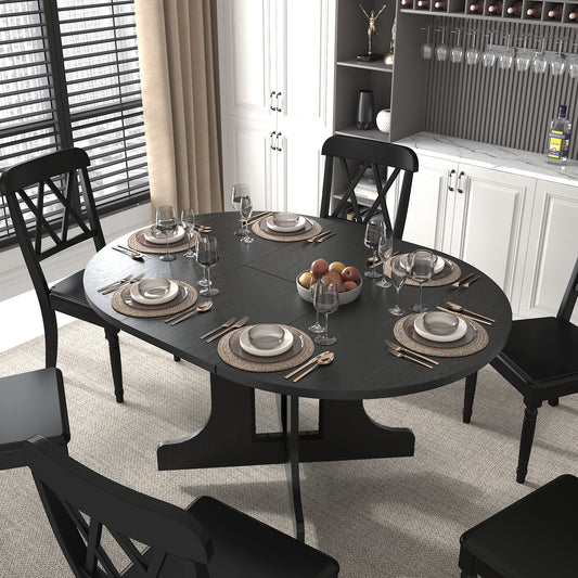 Black round dining table set with crossback chairs perfect for intimate gatherings
