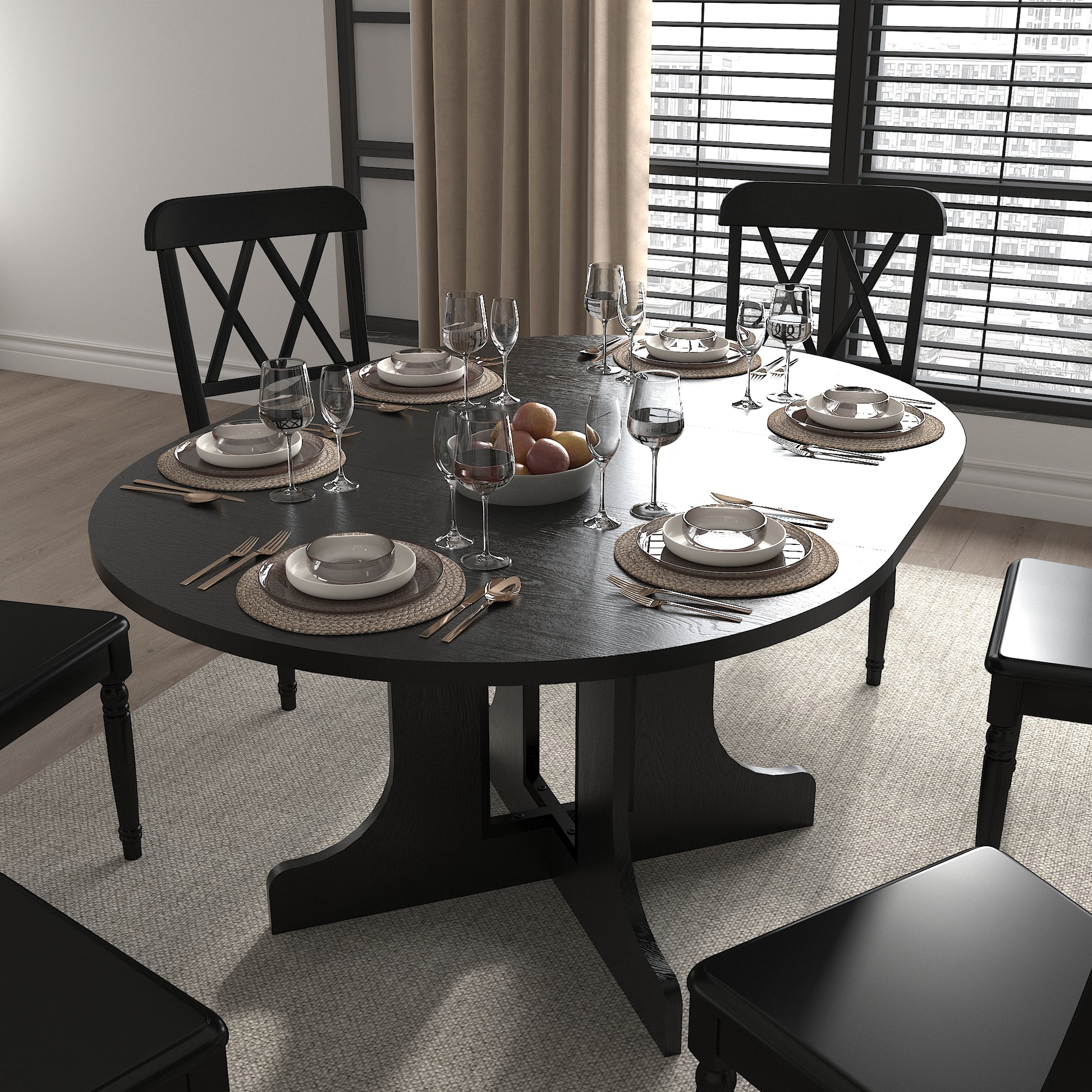 Black oval dining table set with four crossback chairs fully set for a meal