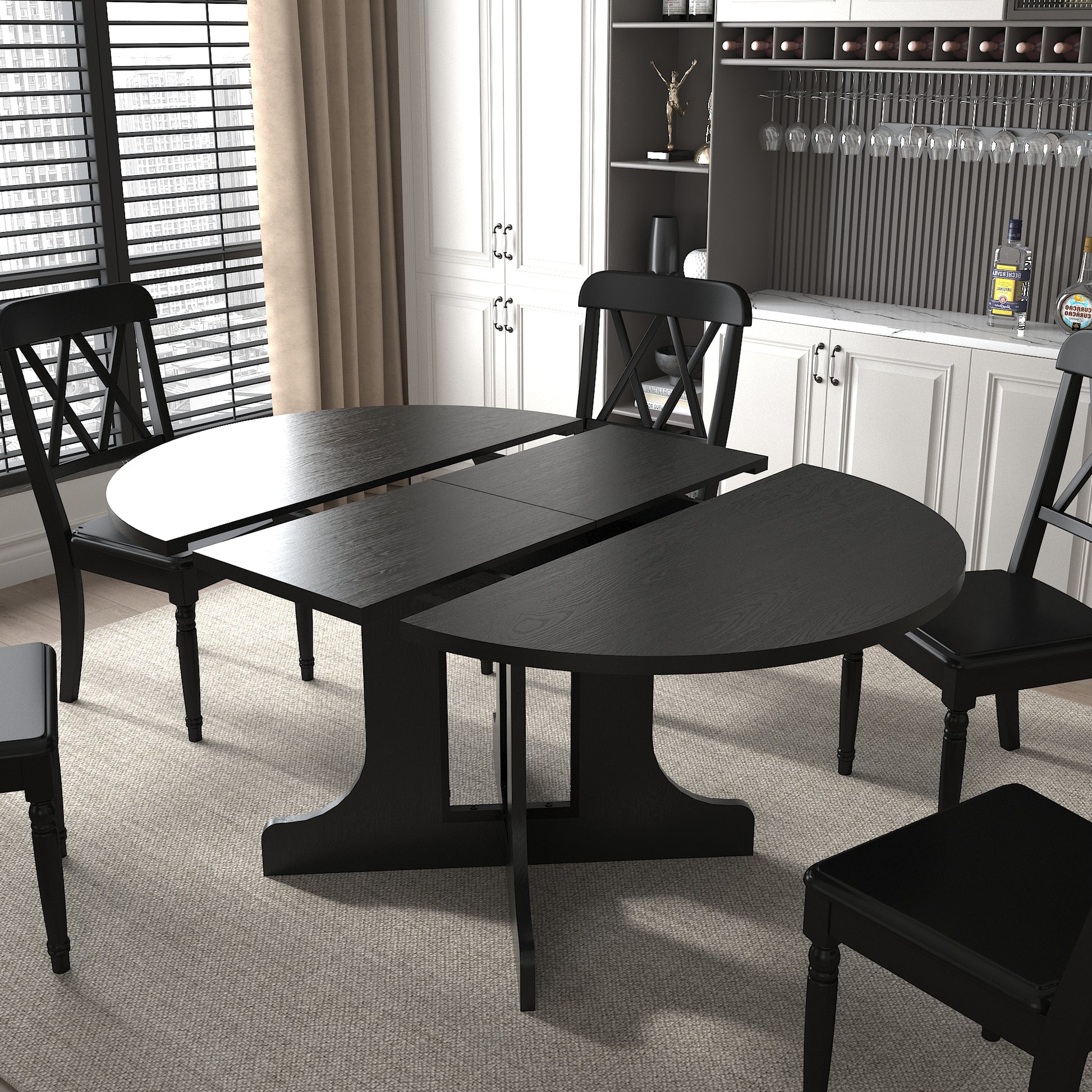 Black expandable dining table with Xback chairs for versatile seating