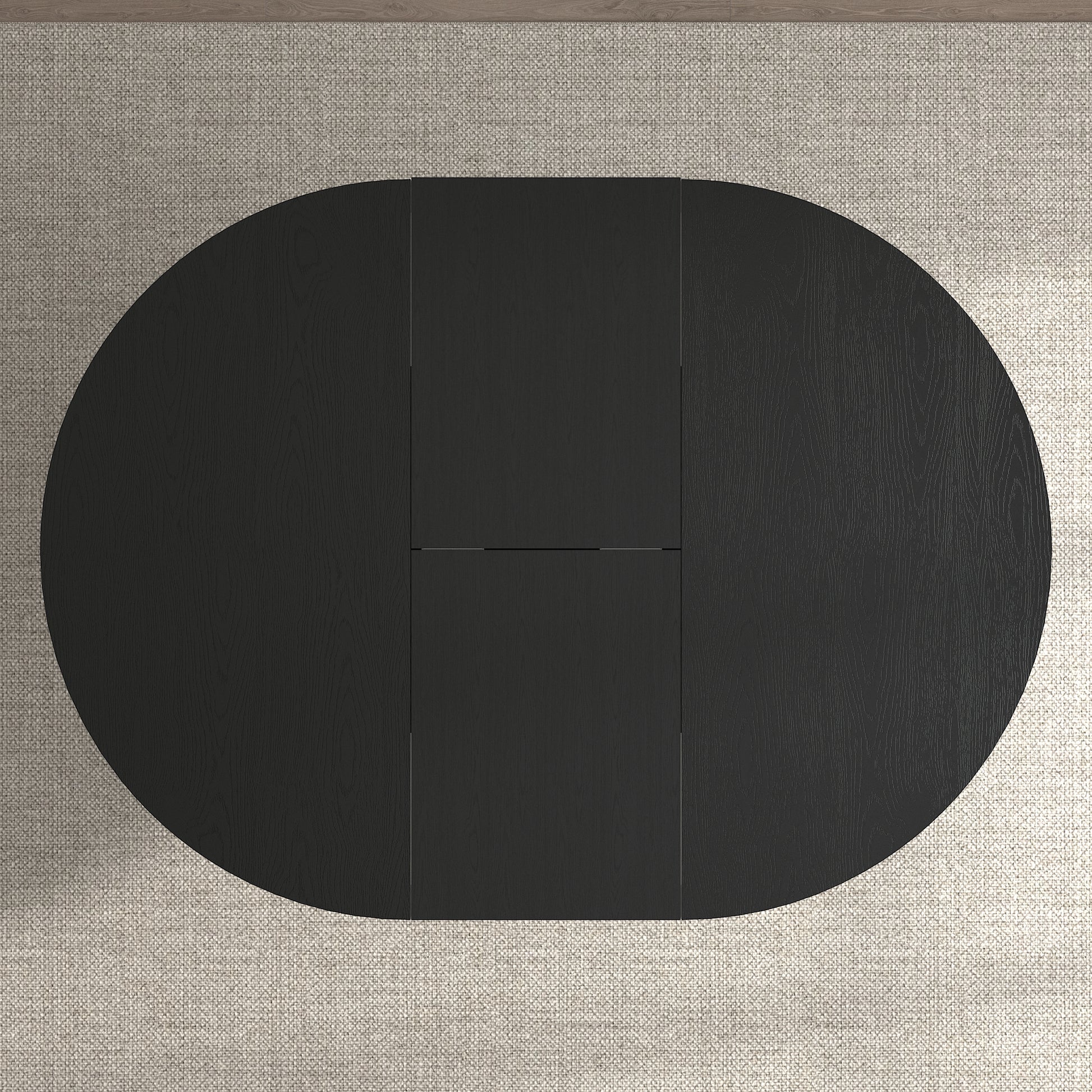 Black oval dining table with wood grain detail and drop leaves
