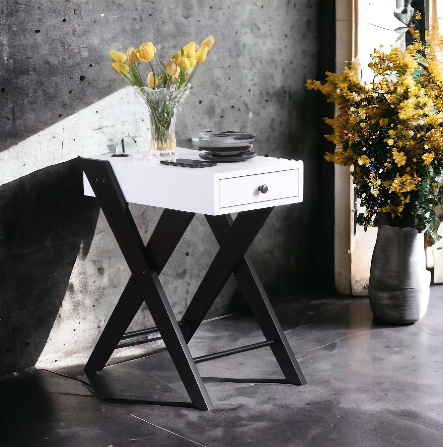 White side table with black Xframe legs and a single drawer perfect for a modern bedroom