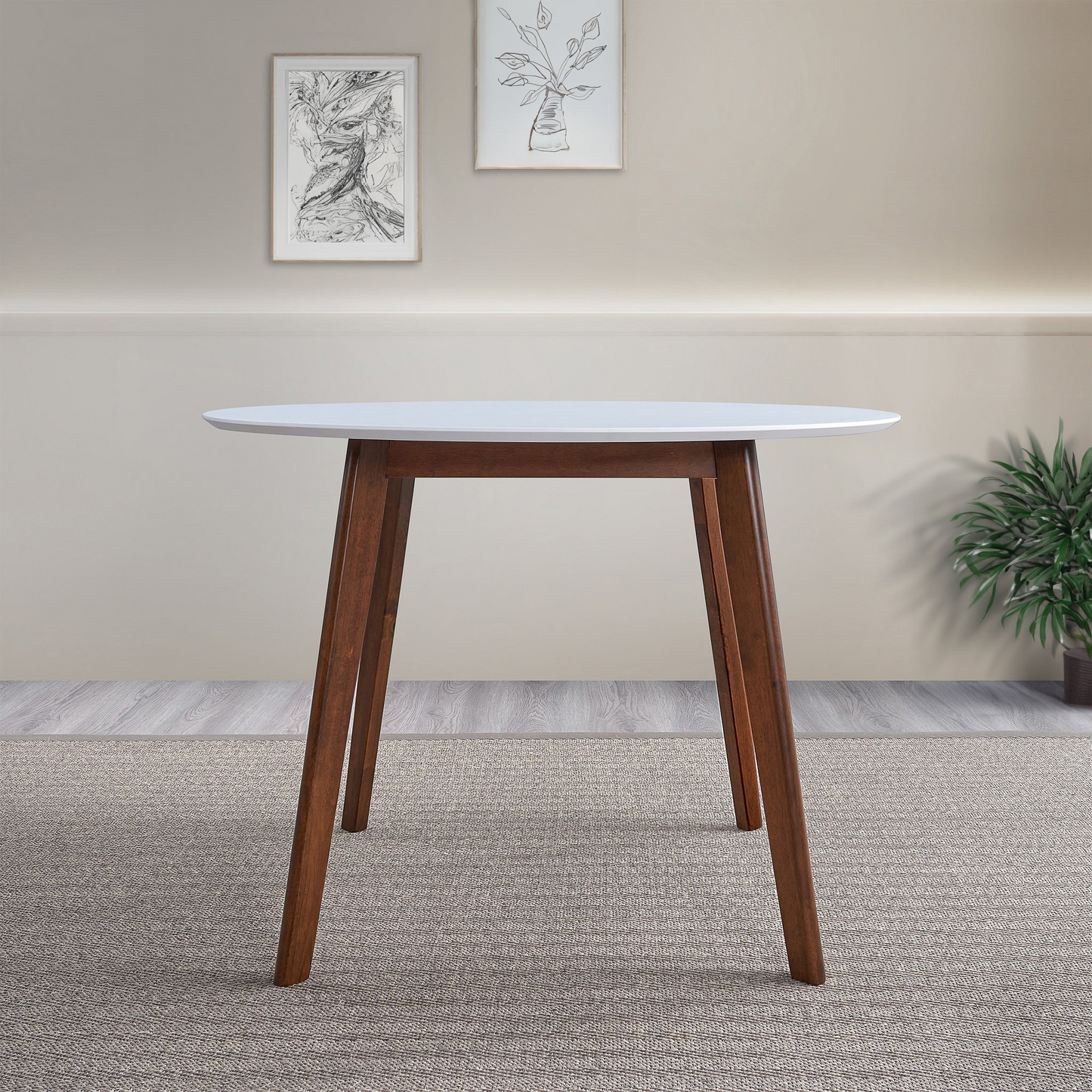 Round white dining table with dark wood tapered legs modern midcentury design