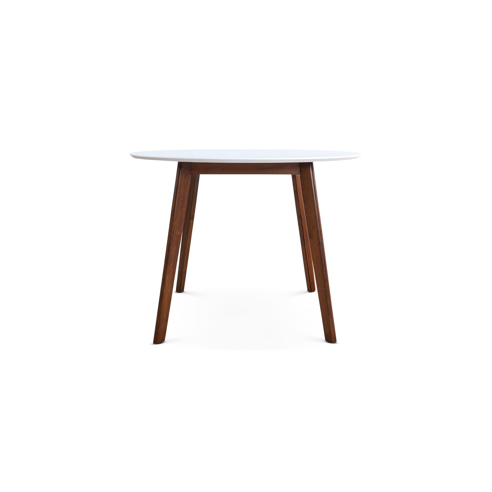 Round white dining table with tapered dark wood legs