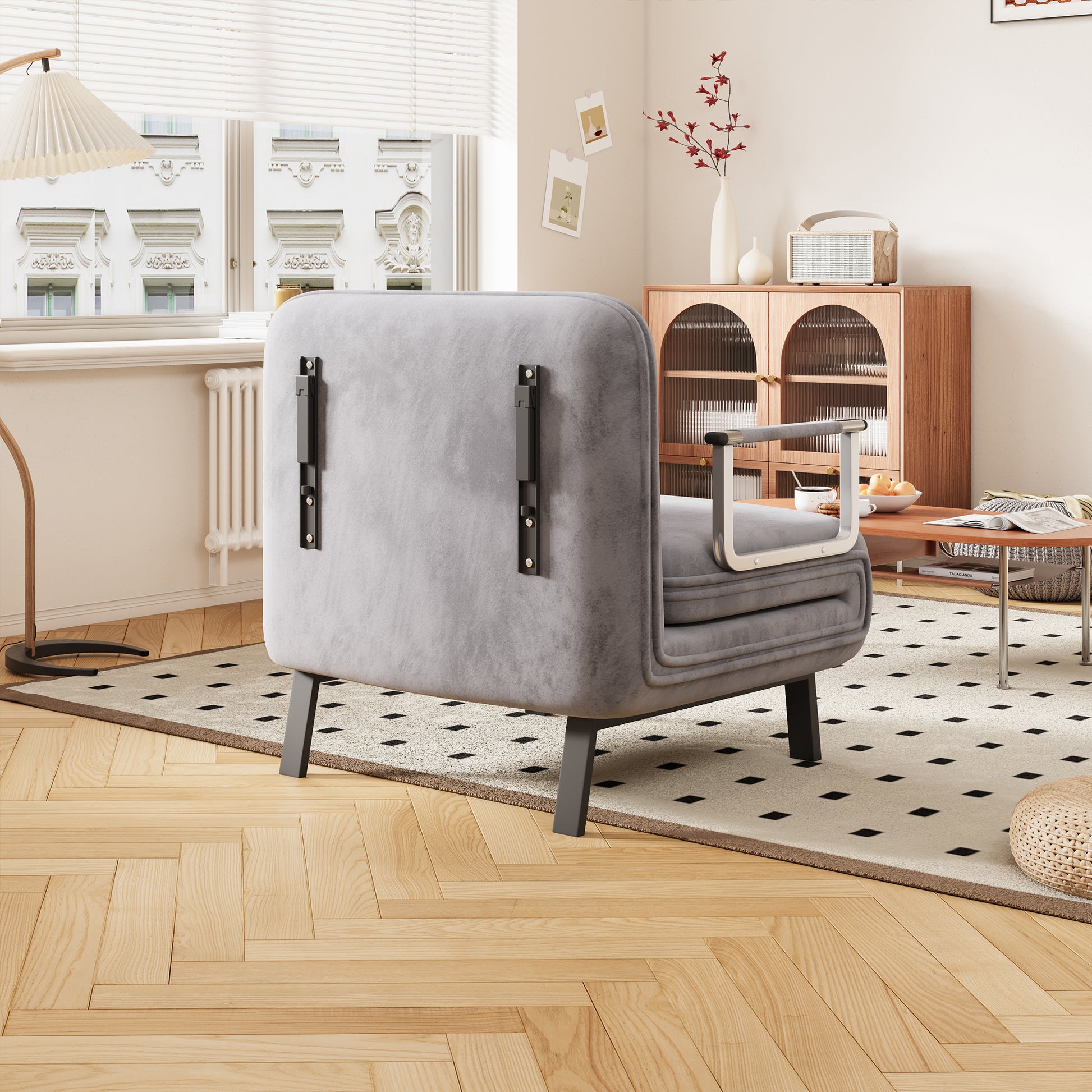 Plush grey armchair with metallic armrests perfect for modern living rooms