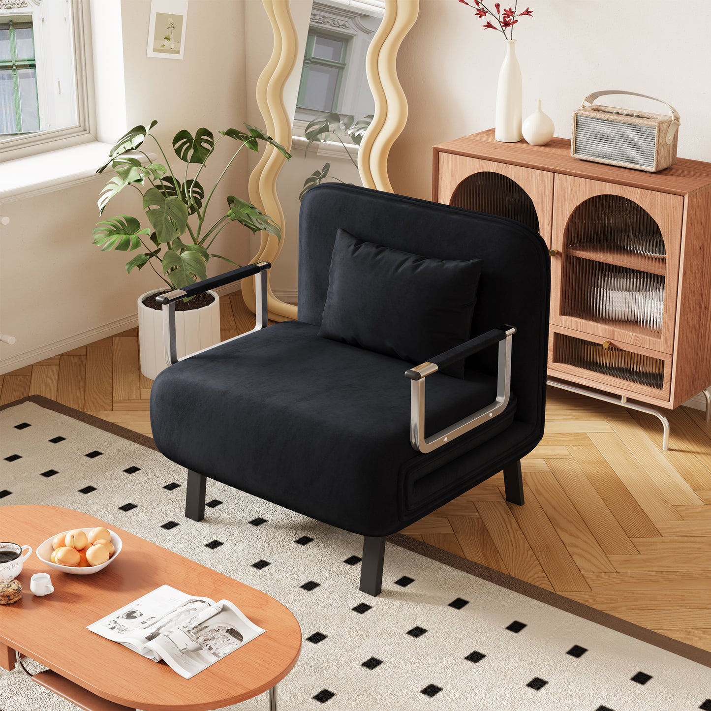 Sleek black velvet armchair with chrome accents perfect for modern living spaces