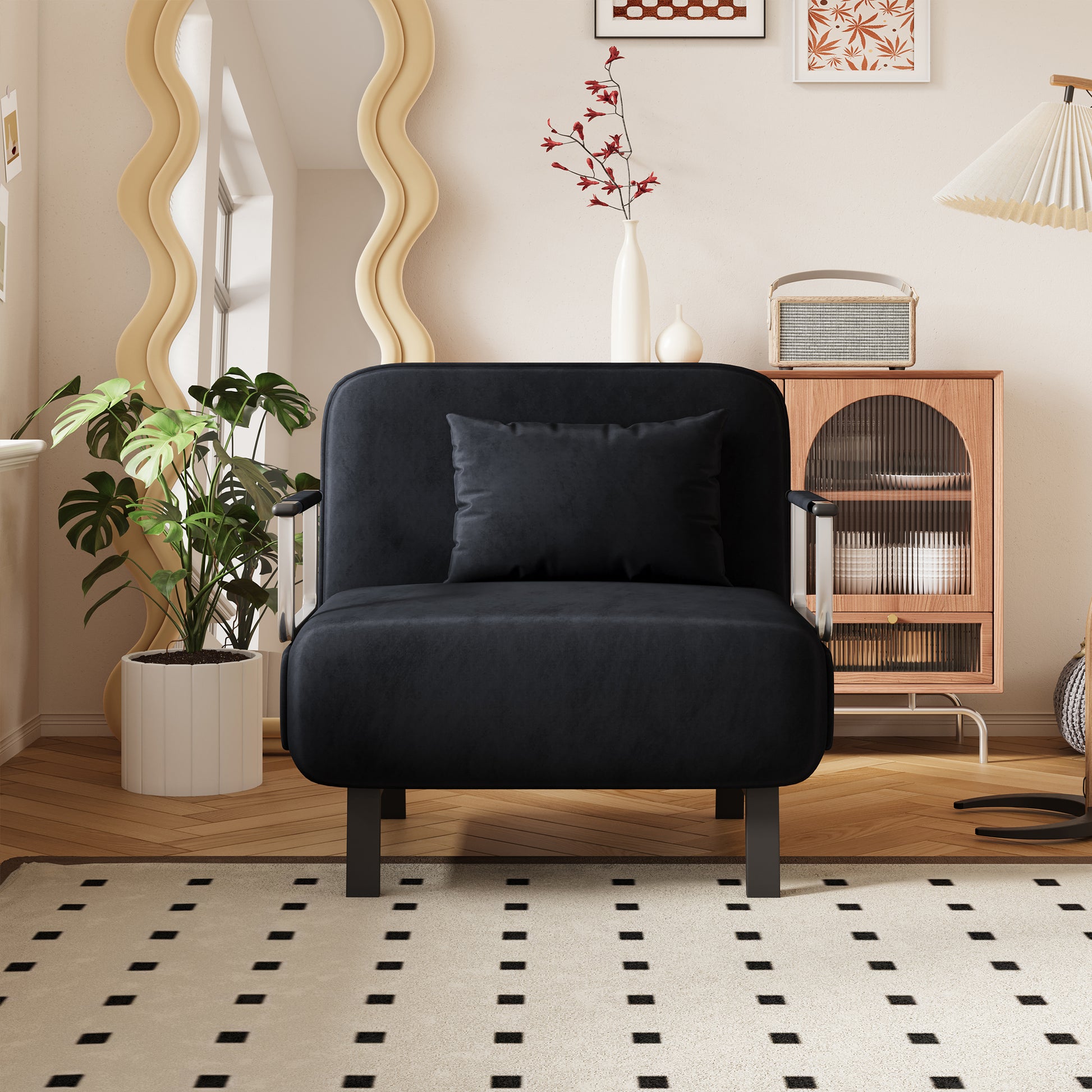Plush black accent chair with a comfortable seat cushion and silver armrests for a modern living room