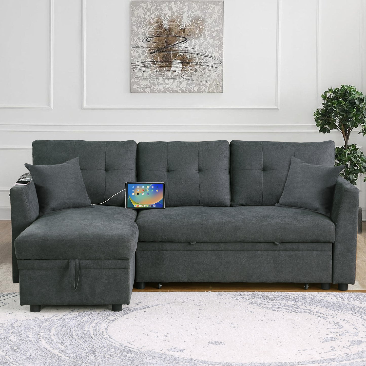 Dark gray sectional sofa with tufted cushions and builtin storage