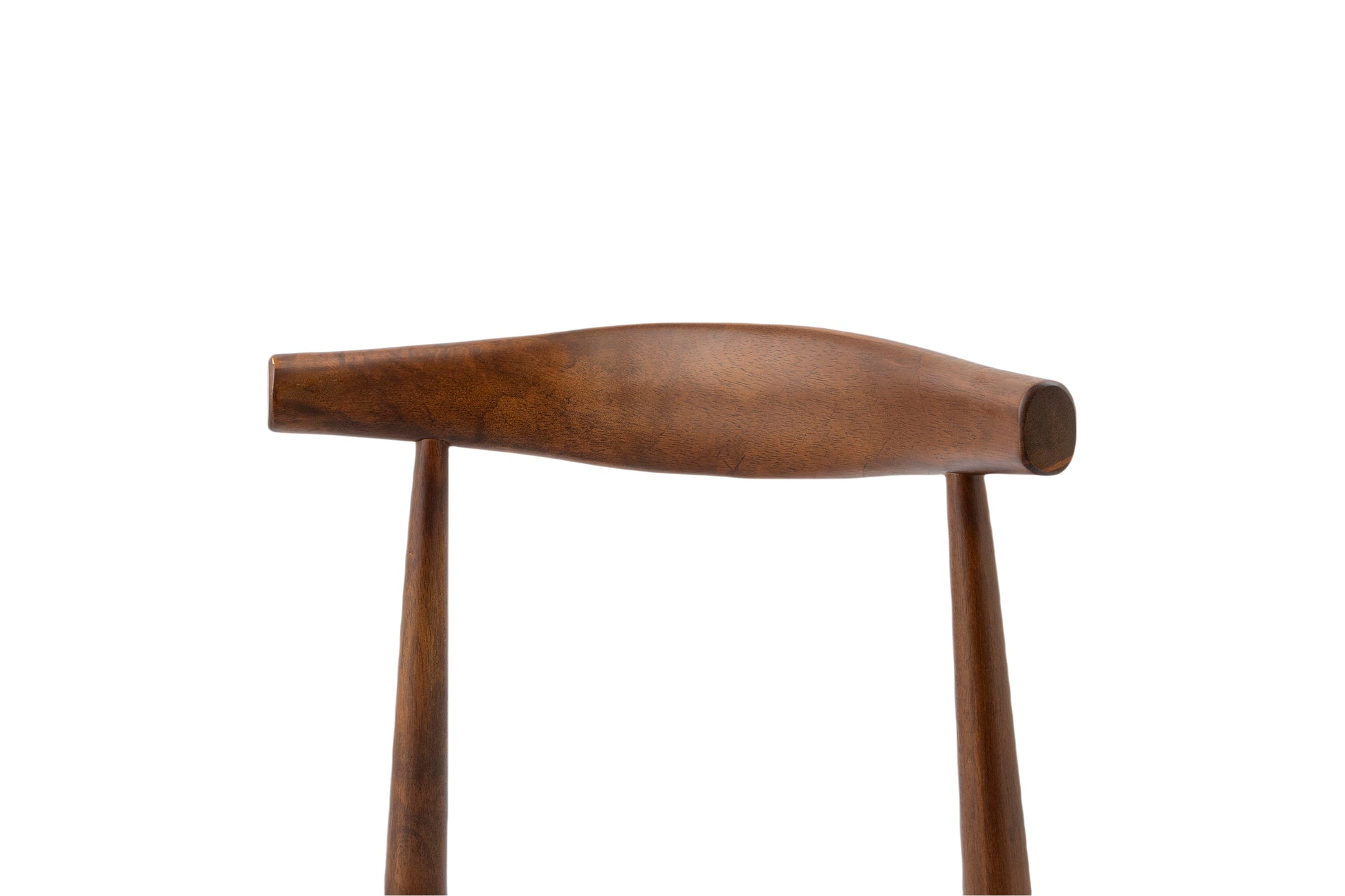 Curved dark wood spindle chair back with tapered legs for midcentury modern decor
