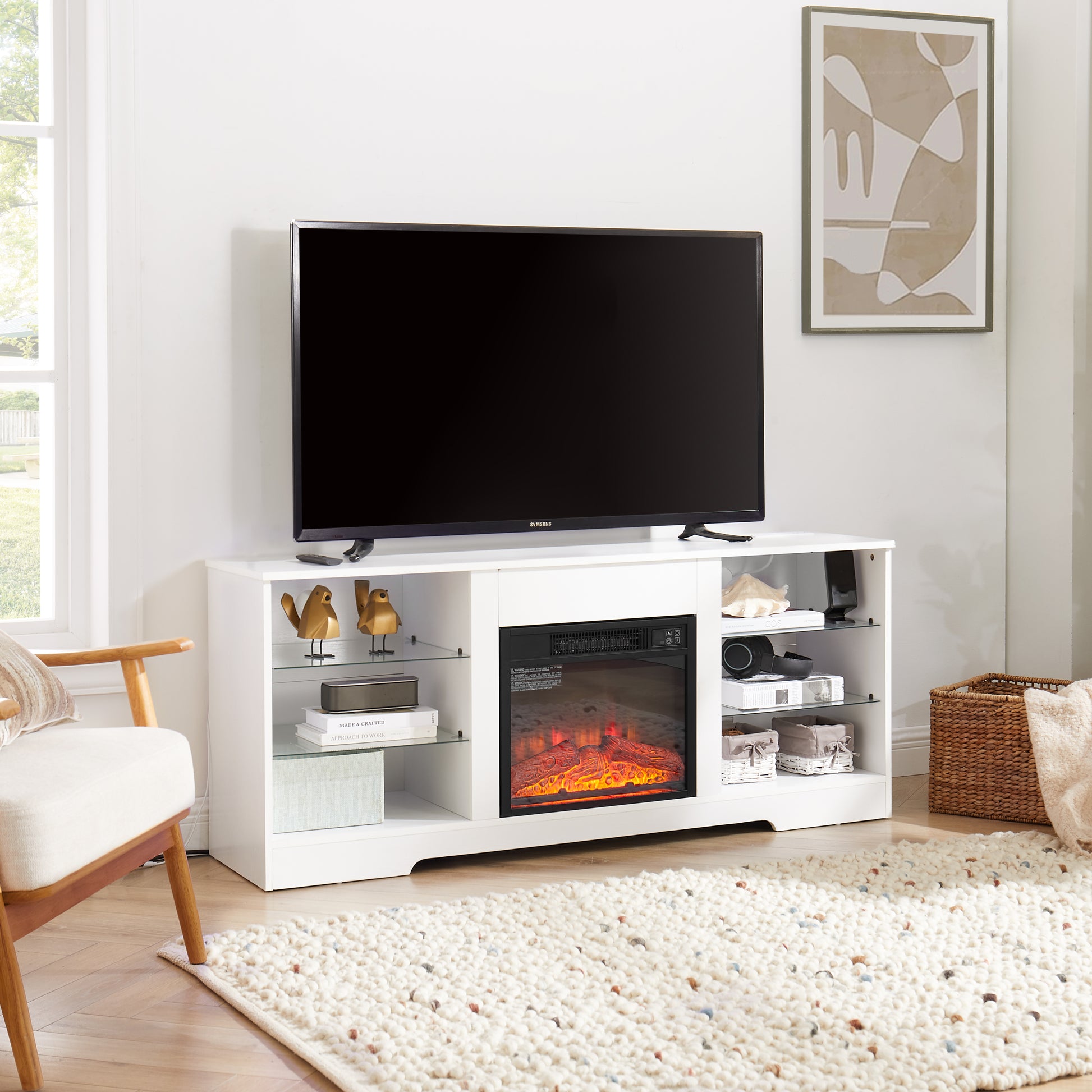 White entertainment center with electric fireplace and glass shelves holding a TV