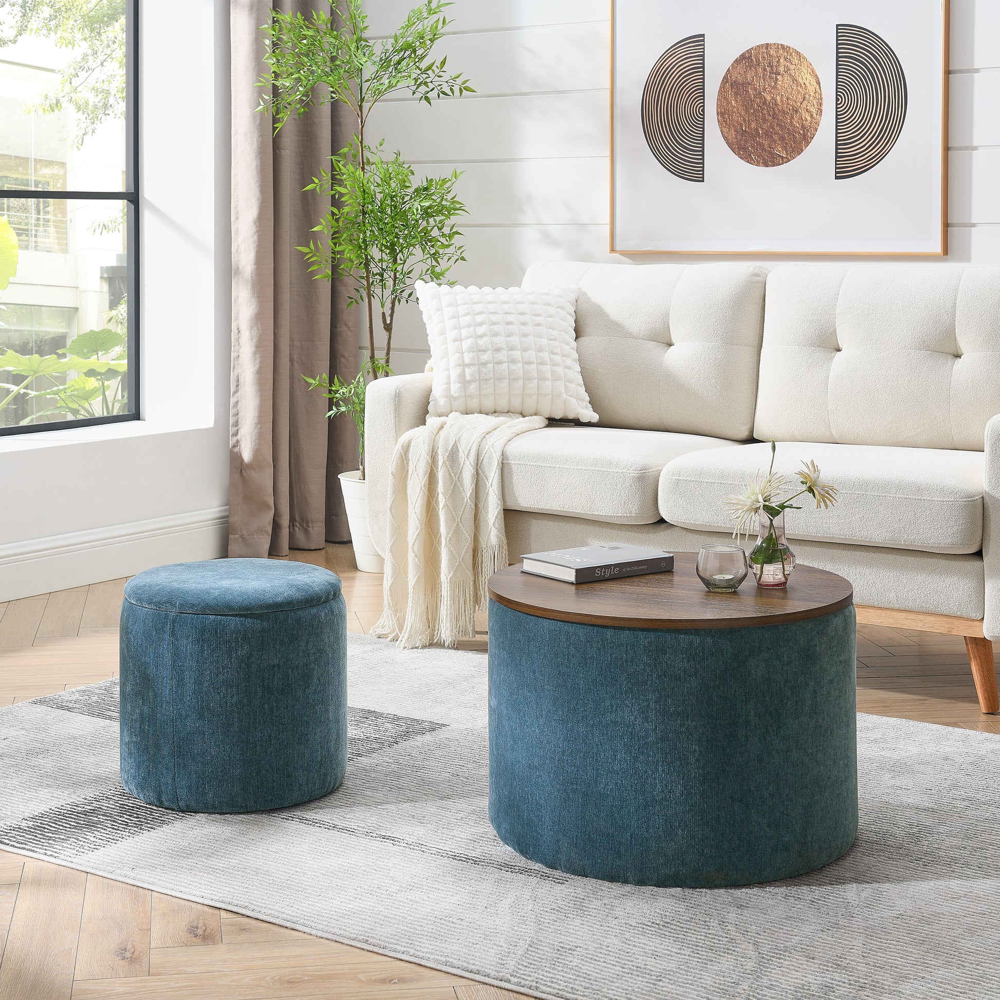Textured blue fabric ottoman with wooden top and round coffee table in living room