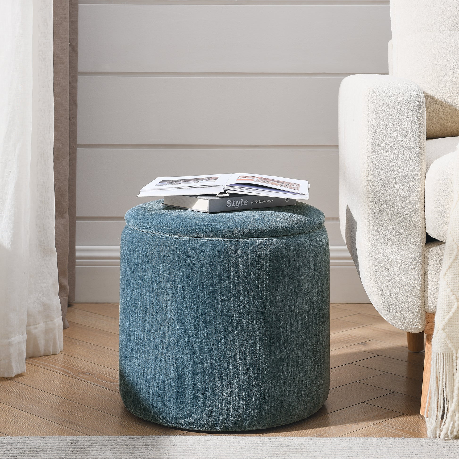 Round teal upholstered ottoman with a storage lid perfect for living rooms