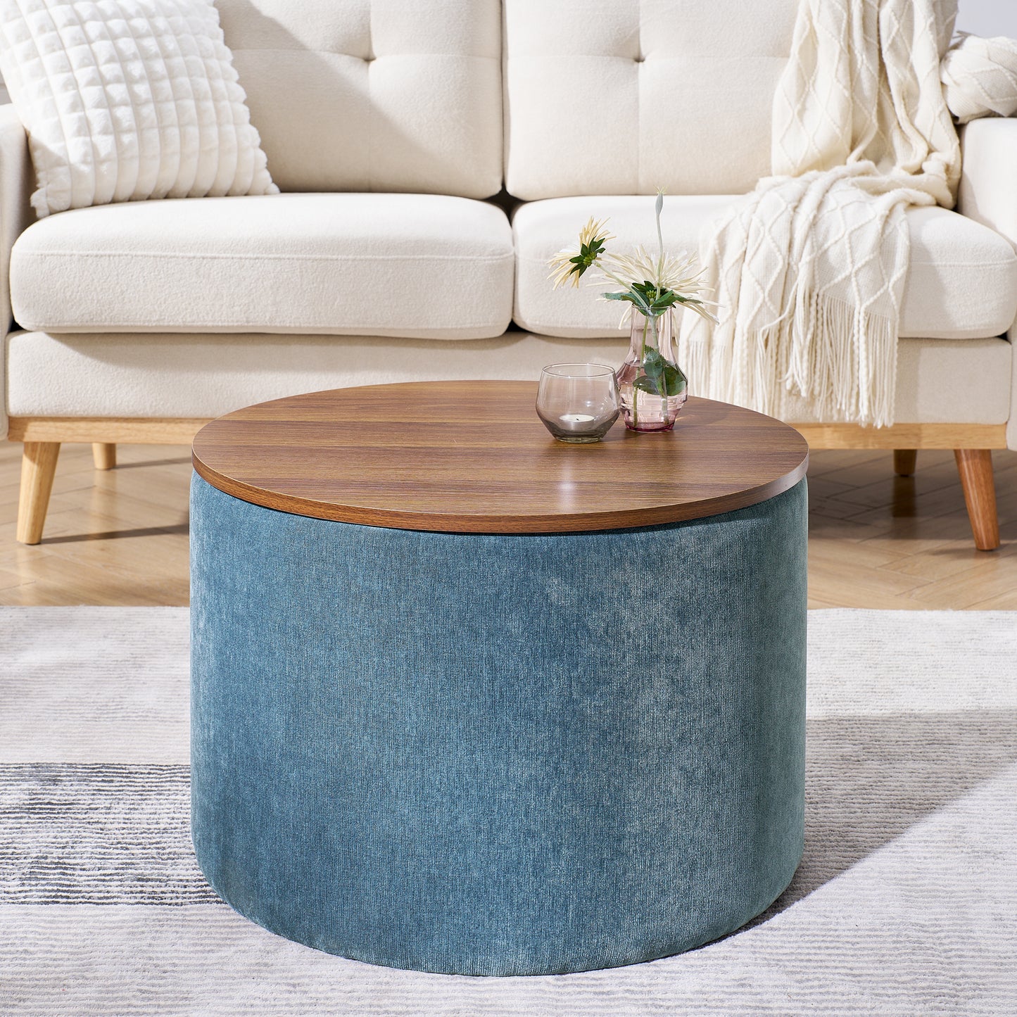 Round teal upholstered ottoman with a wooden lifttop perfect as a coffee table