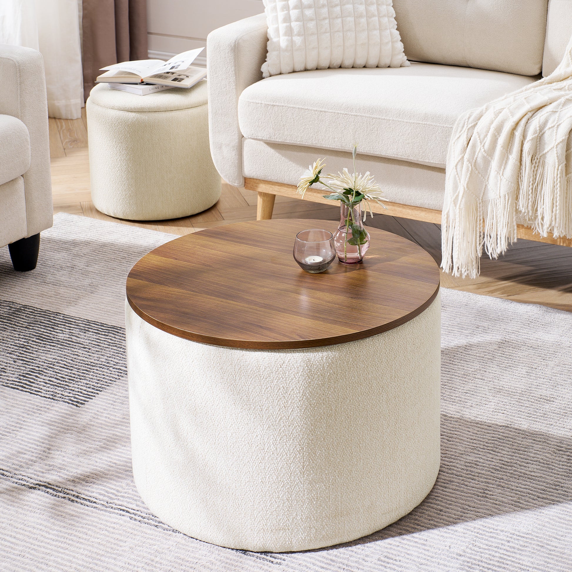 Round storage ottoman with walnut top and textured cream fabric upholstery