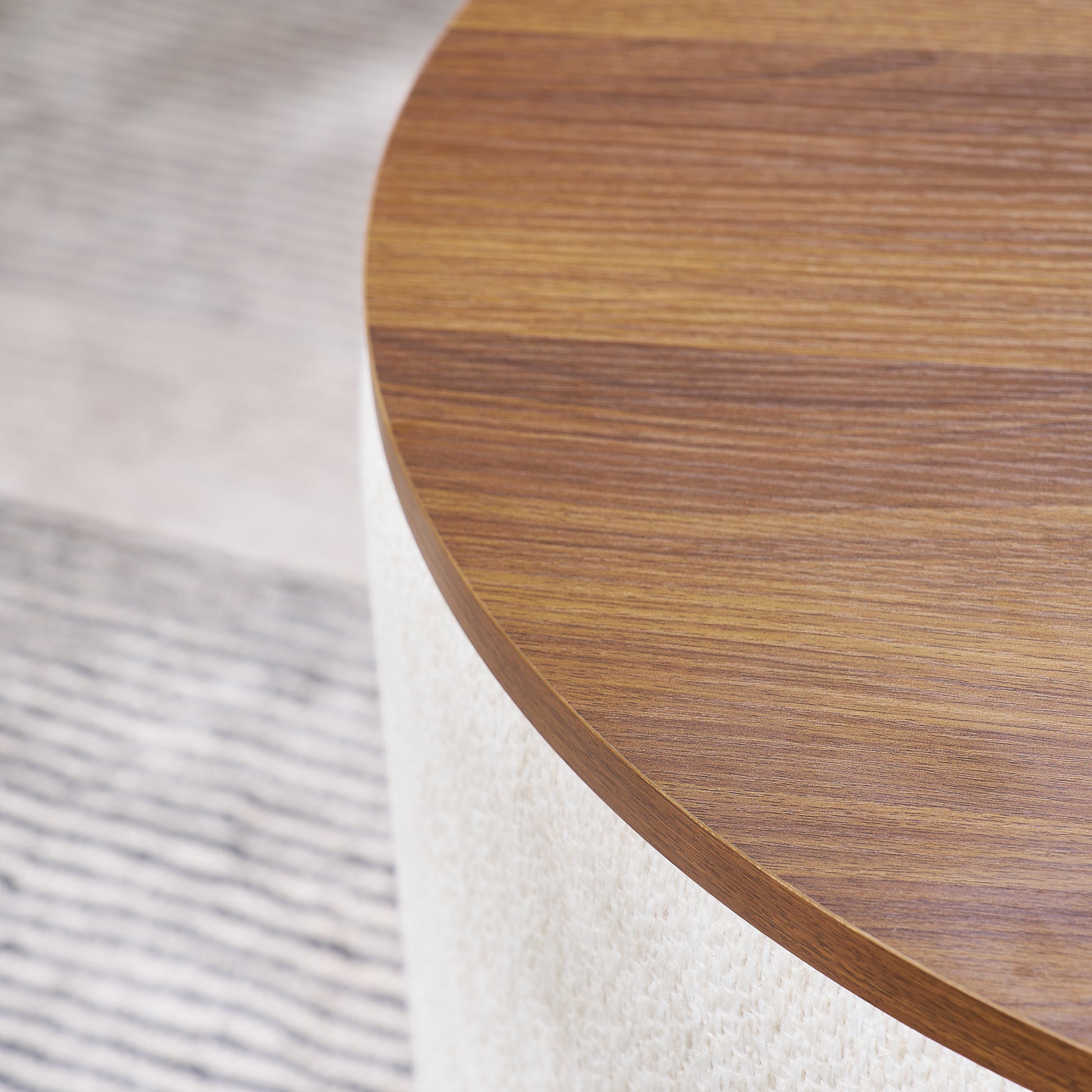 Round walnut wood coffee table with textured ivory base