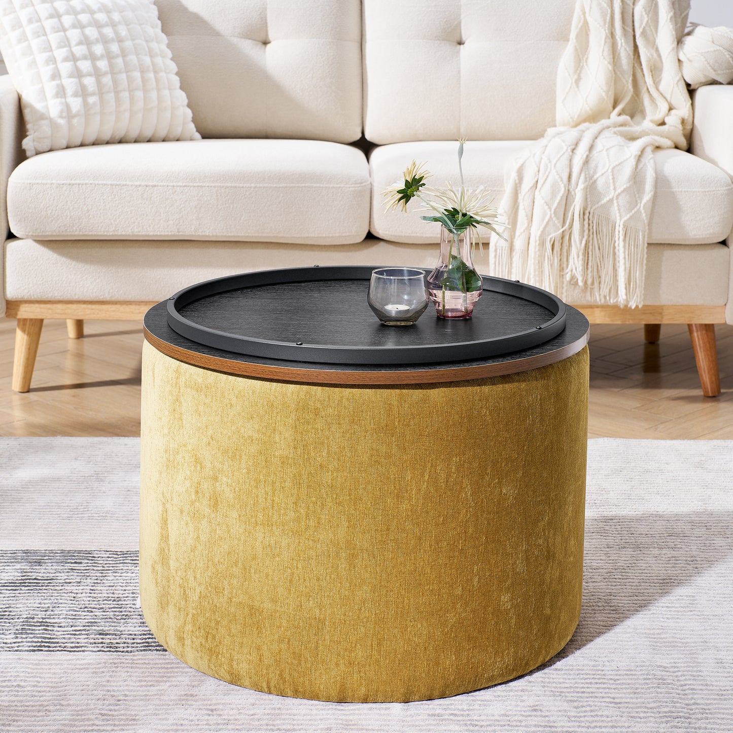 Round mustard ottoman with a liftoff black tray lid for storage