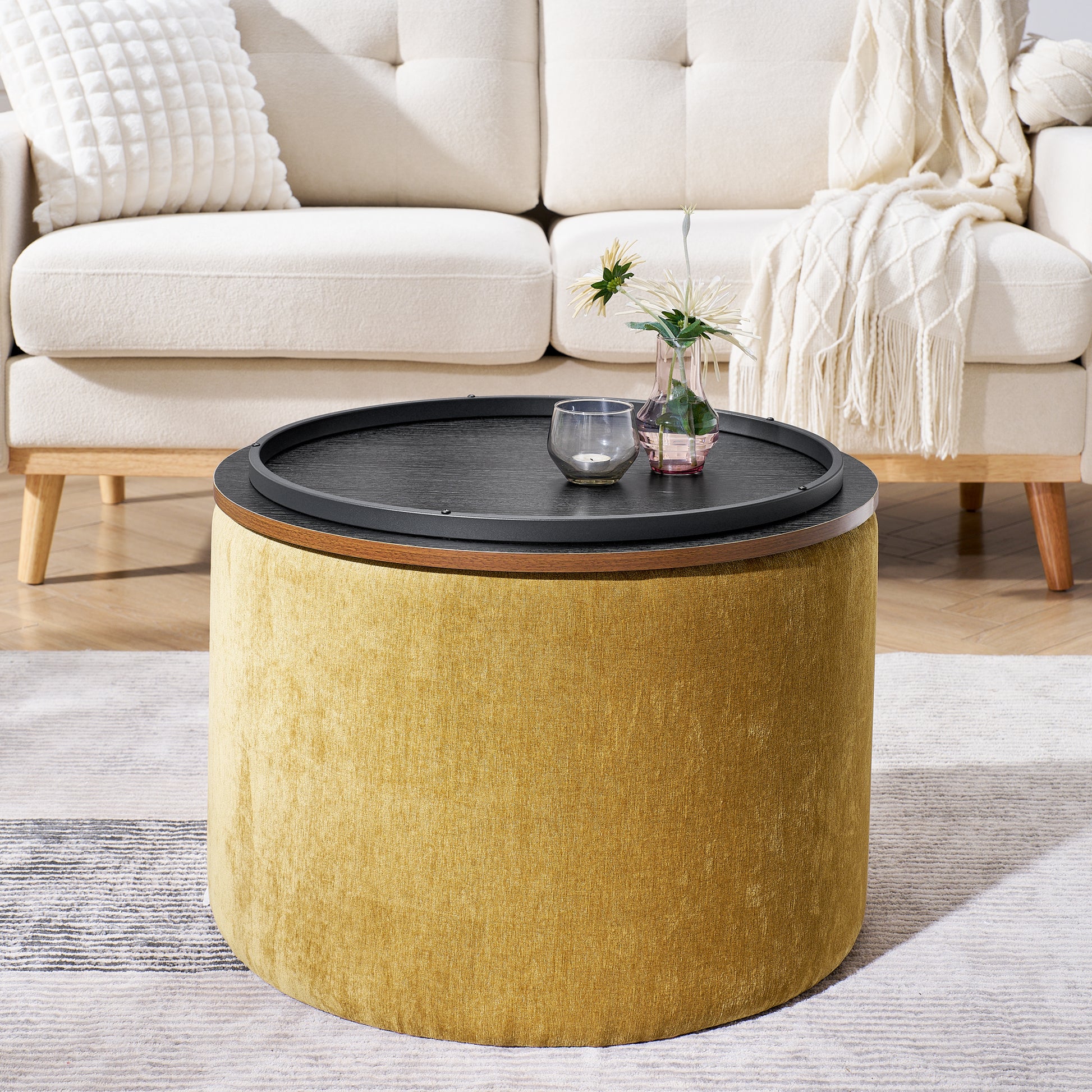 Round mustard ottoman with a liftoff black tray lid for storage