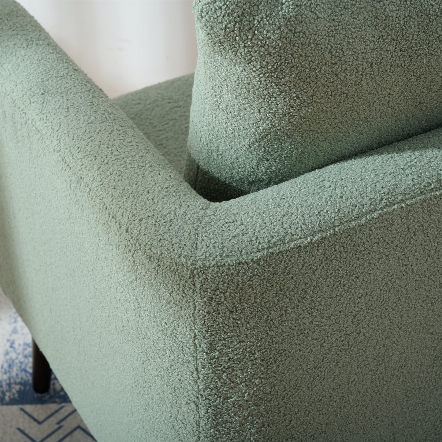 Sage green textured boucle armchair detail soft upholstery for living room comfort