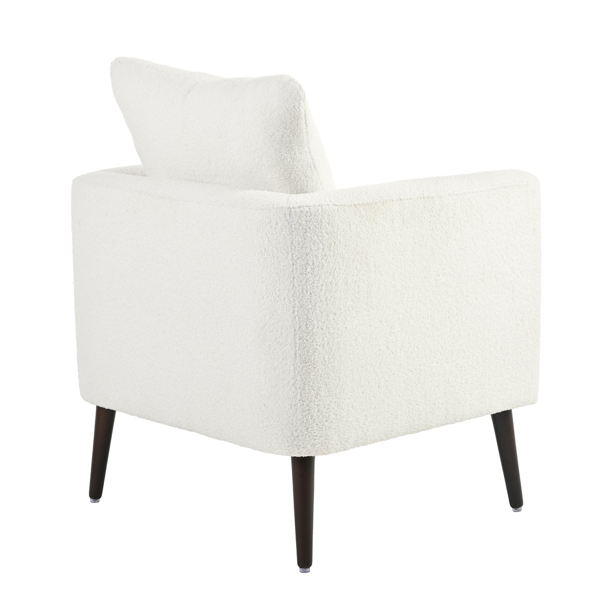 Cream boucl armchair with dark tapered legs perfect for a cozy living room accent piece