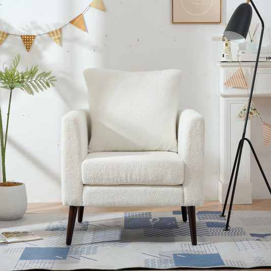 Plush cream boucle armchair with dark wood legs perfect for cozy living spaces
