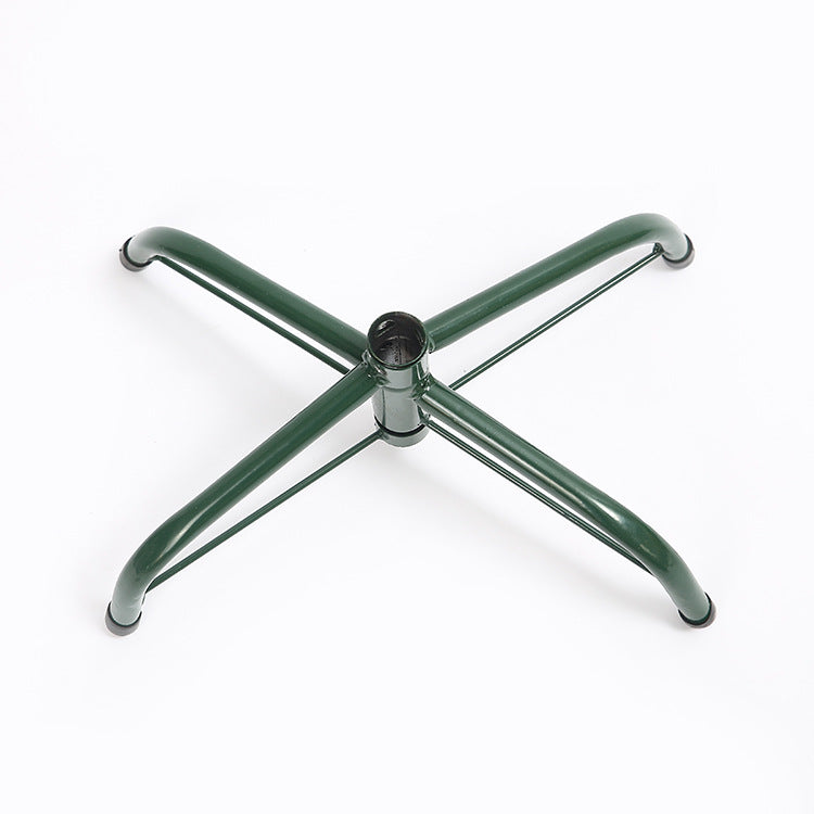 Green metal Christmas tree stand with four sturdy legs essential for holiday decorating