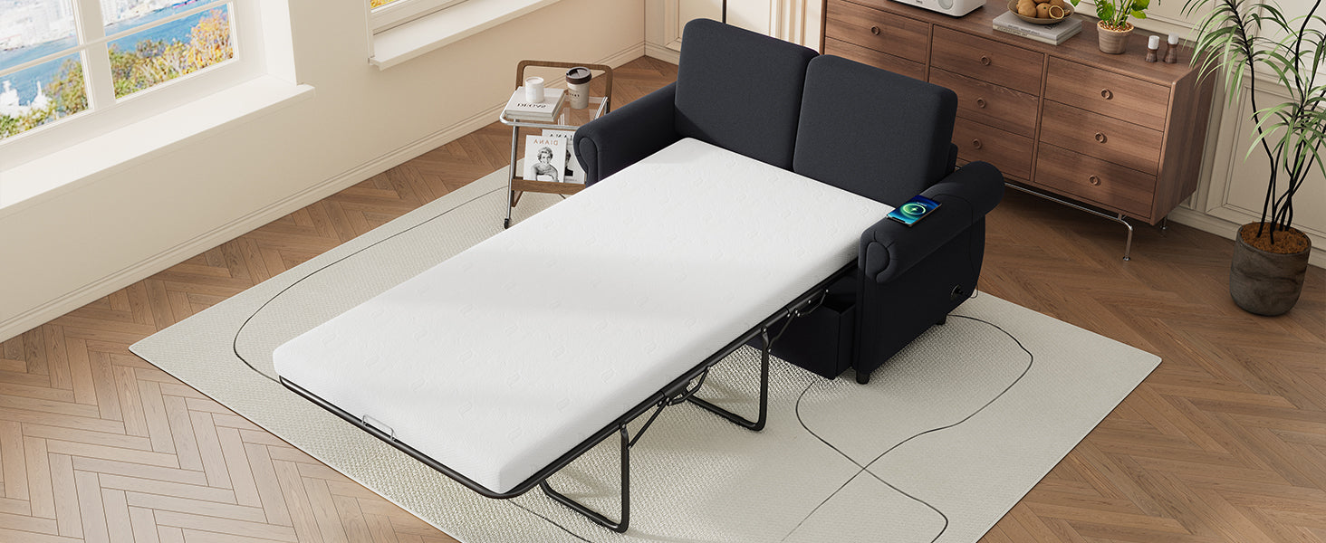 Dark navy sofa bed with extended white mattress and integrated wireless charging on armrest