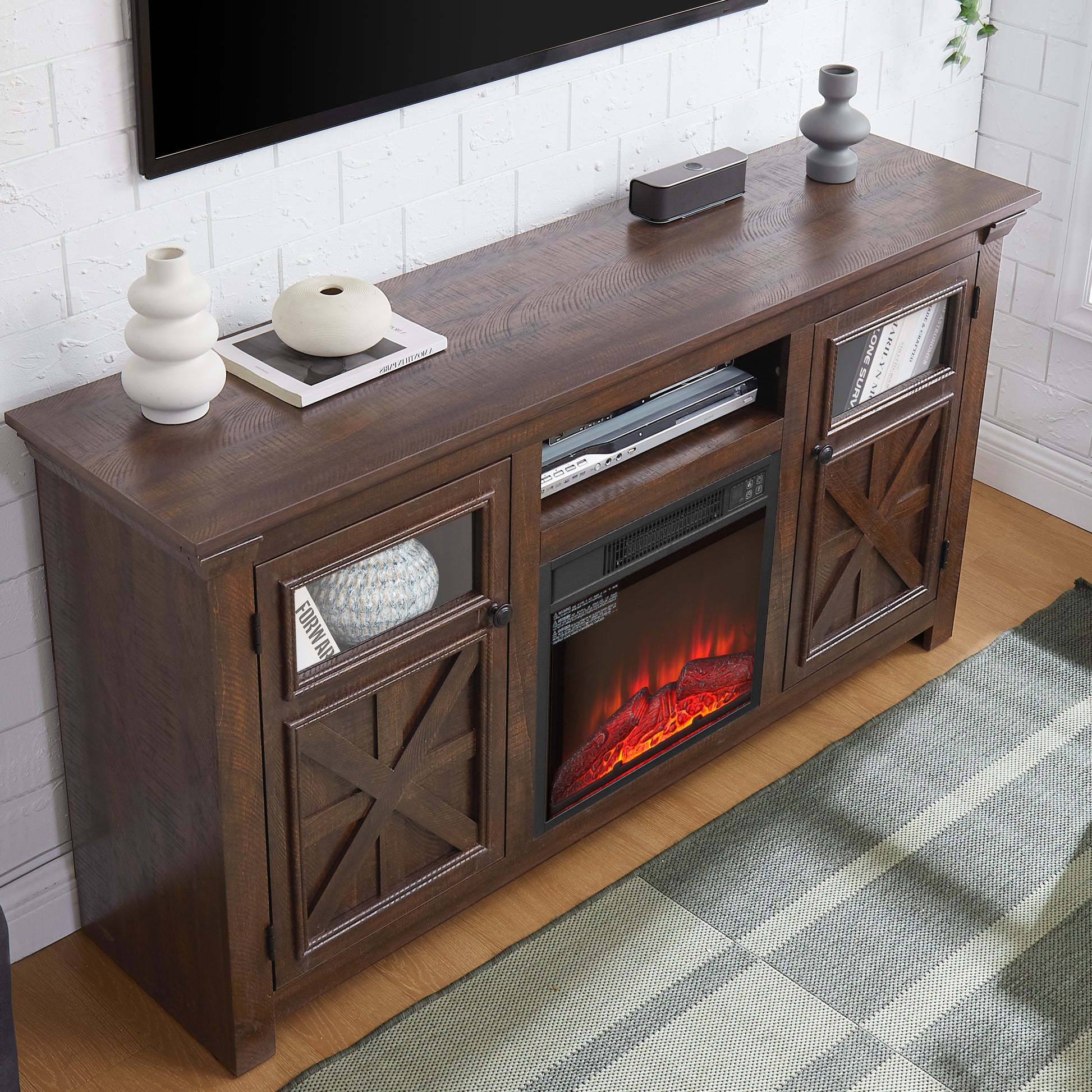 Dark wood TV stand with electric fireplace and glasspaneled doors featuring rustic Xbrace design