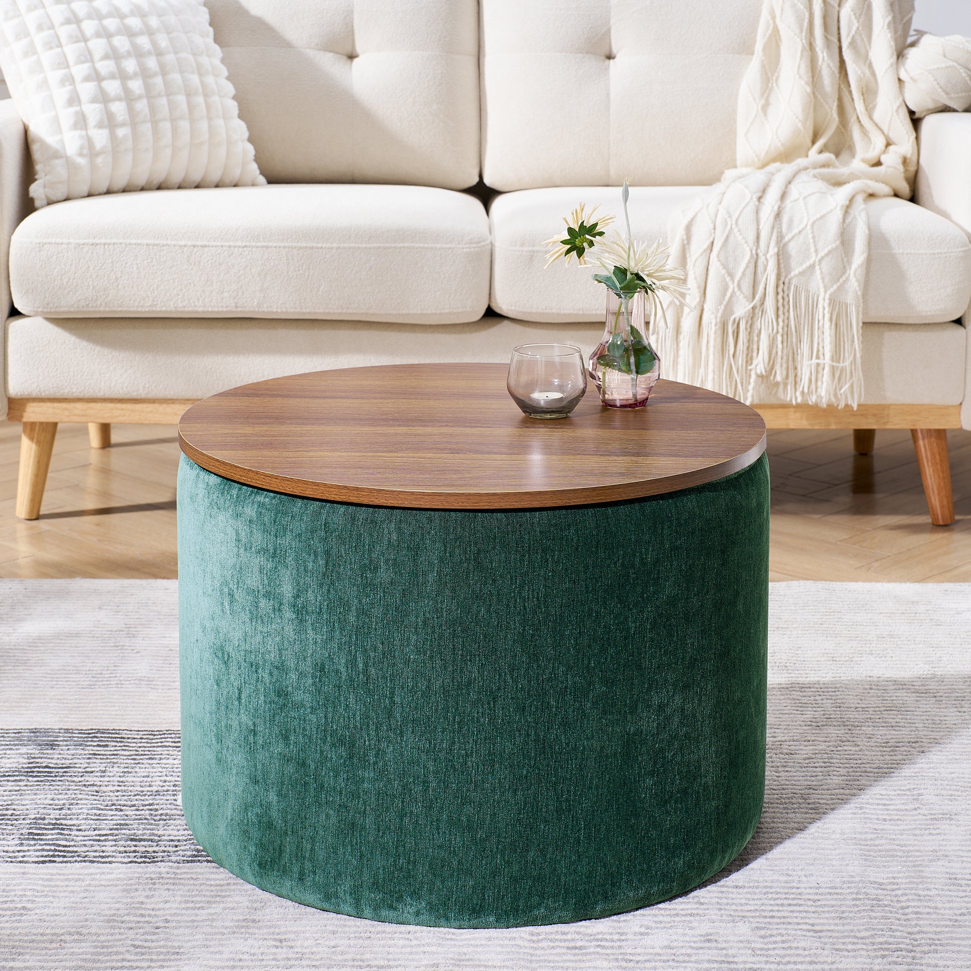 Round velvet storage ottoman in emerald green with a liftoff woodgrain top