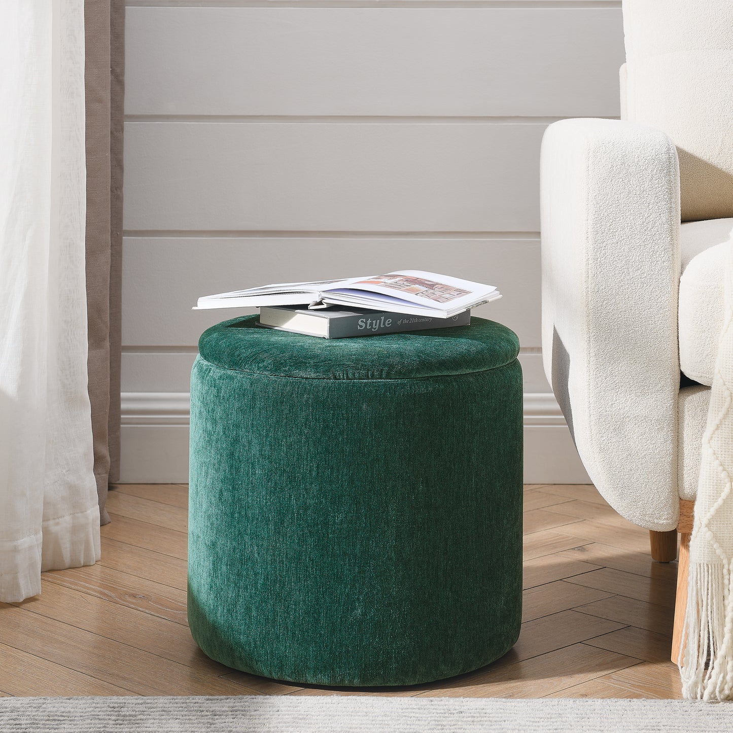 Round emerald green velvet ottoman with storage featuring a plush texture and modern design perfect as footrest