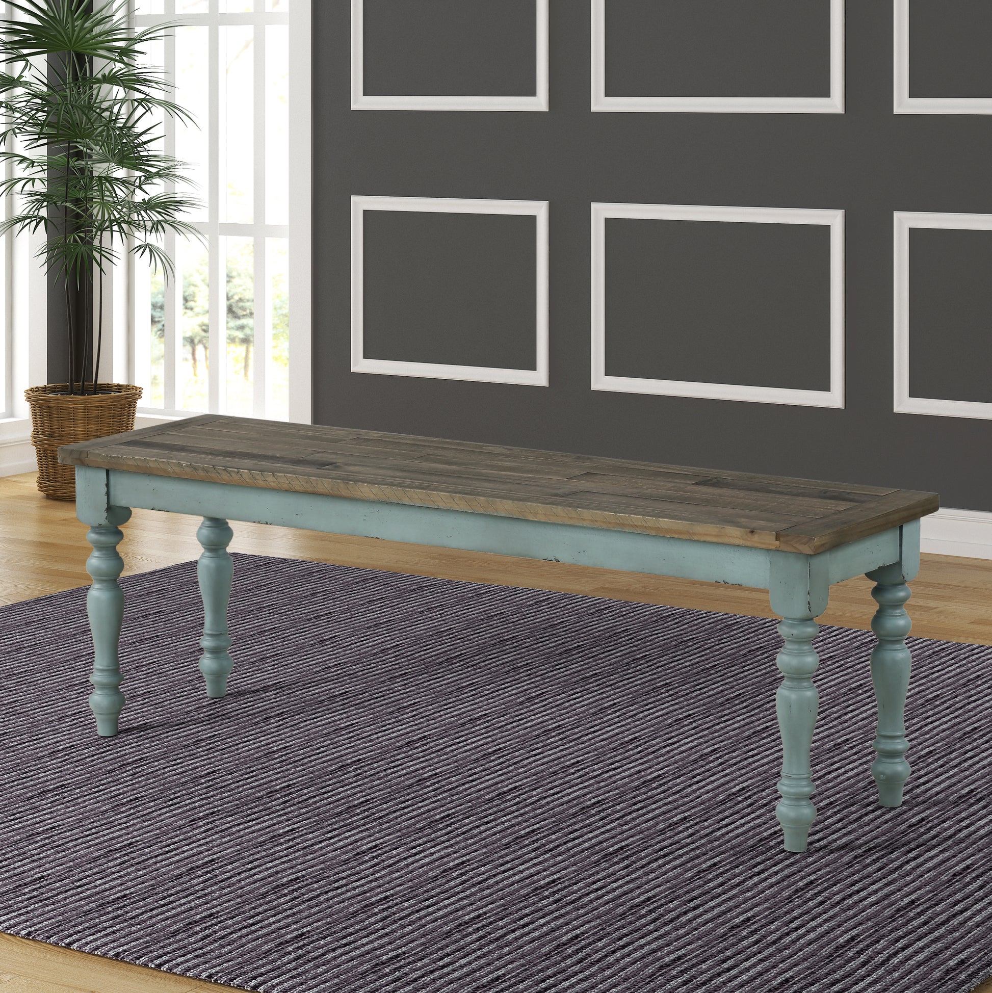 Distressed blue farmhouse bench with weathered wood top and turned legs