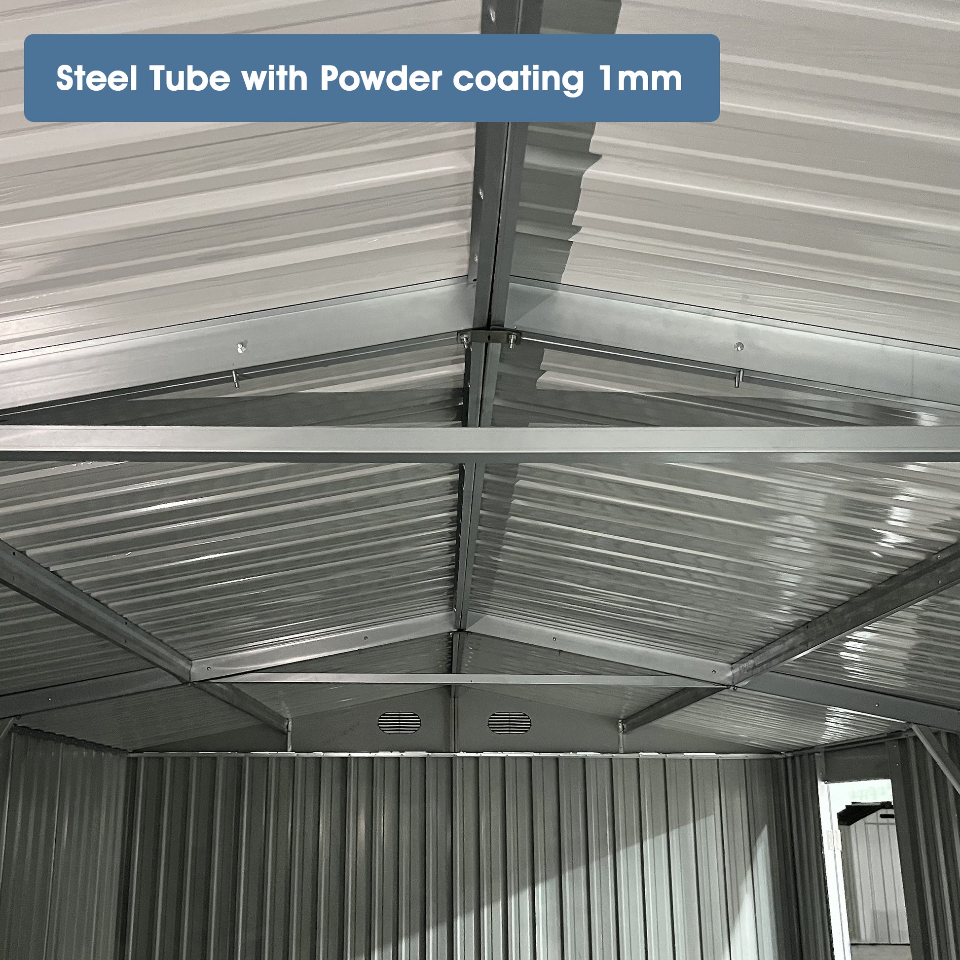 Internal view of a grey steel shed frame with ribbed ceiling panels for durability