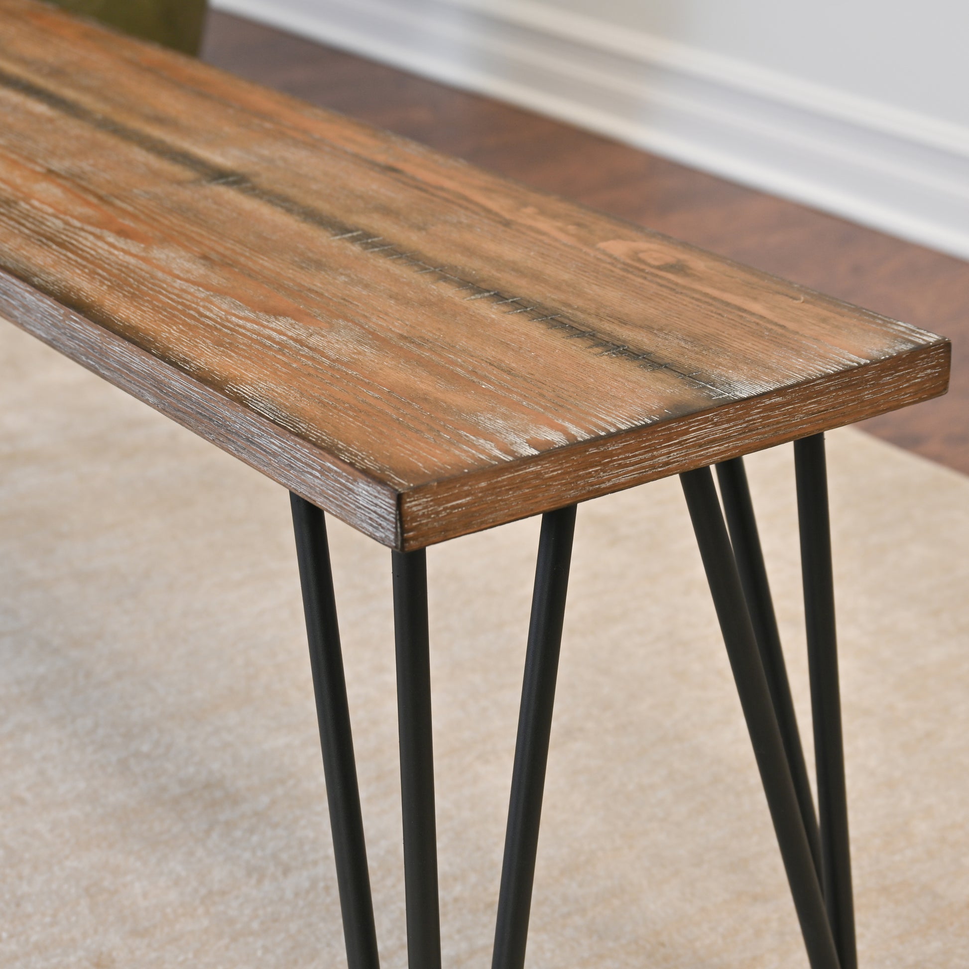 Rustic wooden bench with black hairpin legs