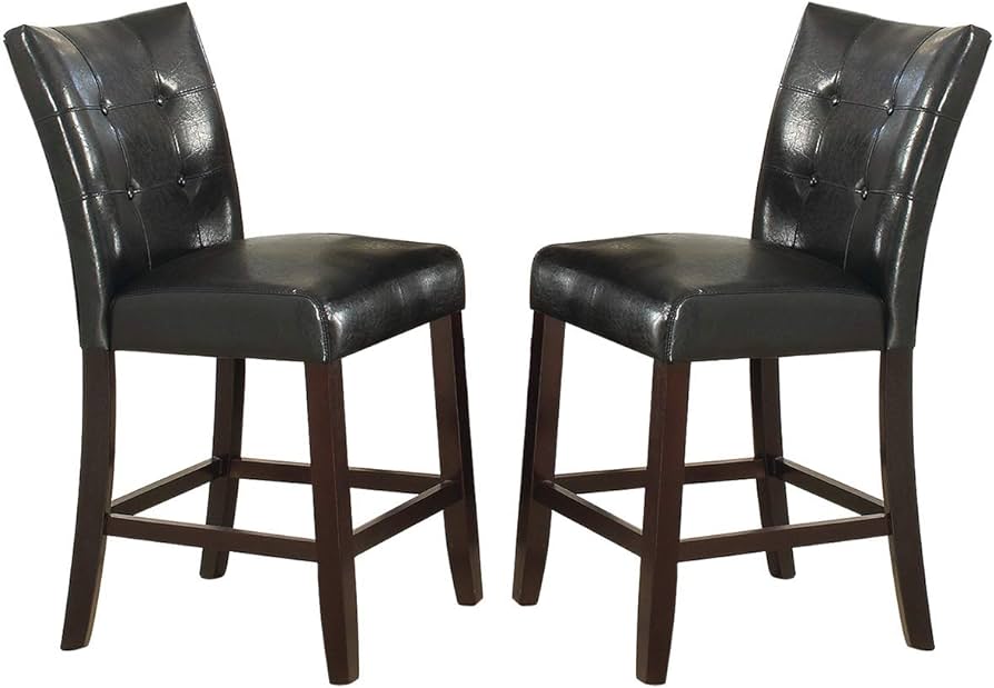 Two tufted black leatherette bar stools with dark wood legs