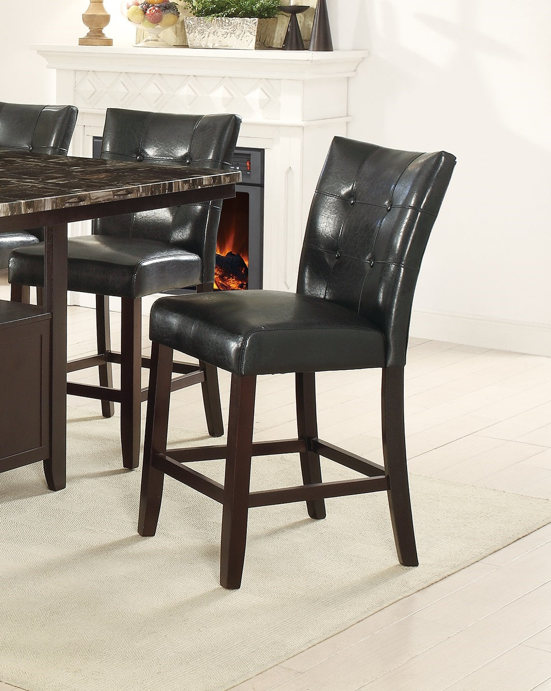Tufted black faux leather bar stool with dark wood frame