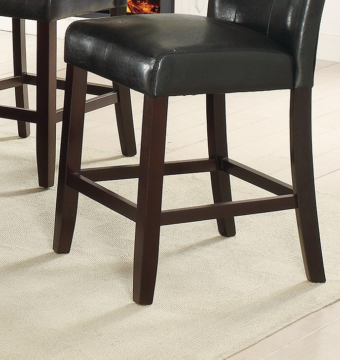Black faux leather bar stool with dark wood legs