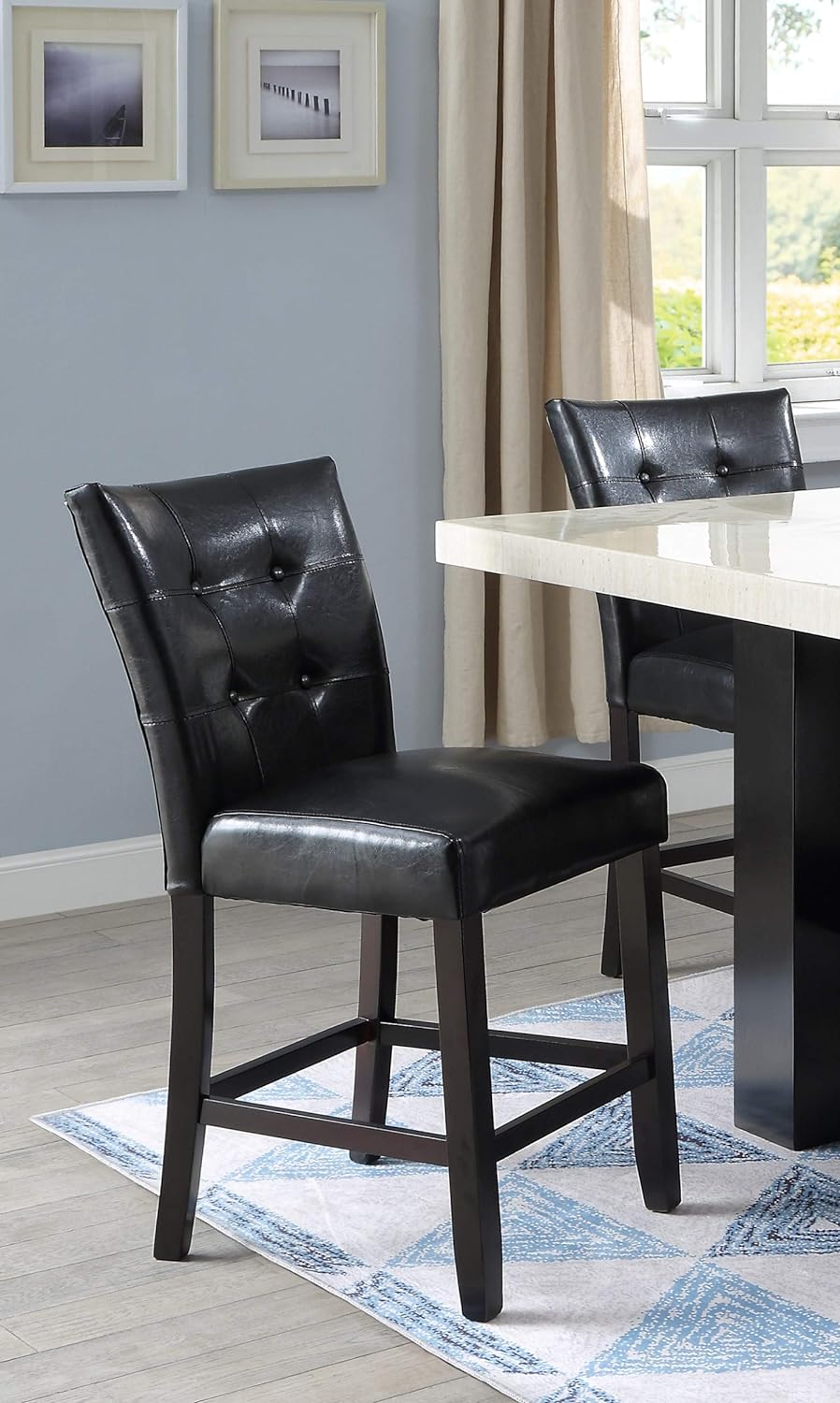 Black tufted faux leather counter stool with dark wood legs