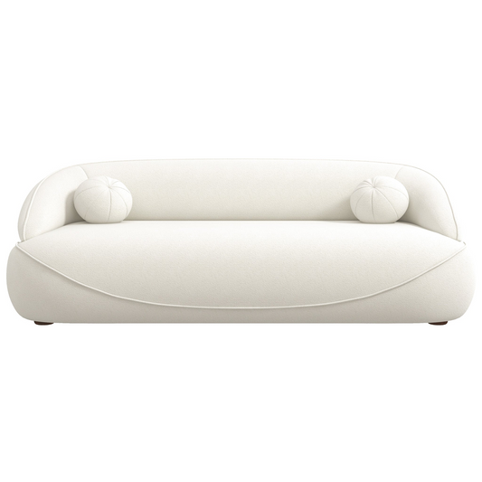 Luxurious offwhite boucle fabric sofa with two spherical accent pillows for modern living spaces
