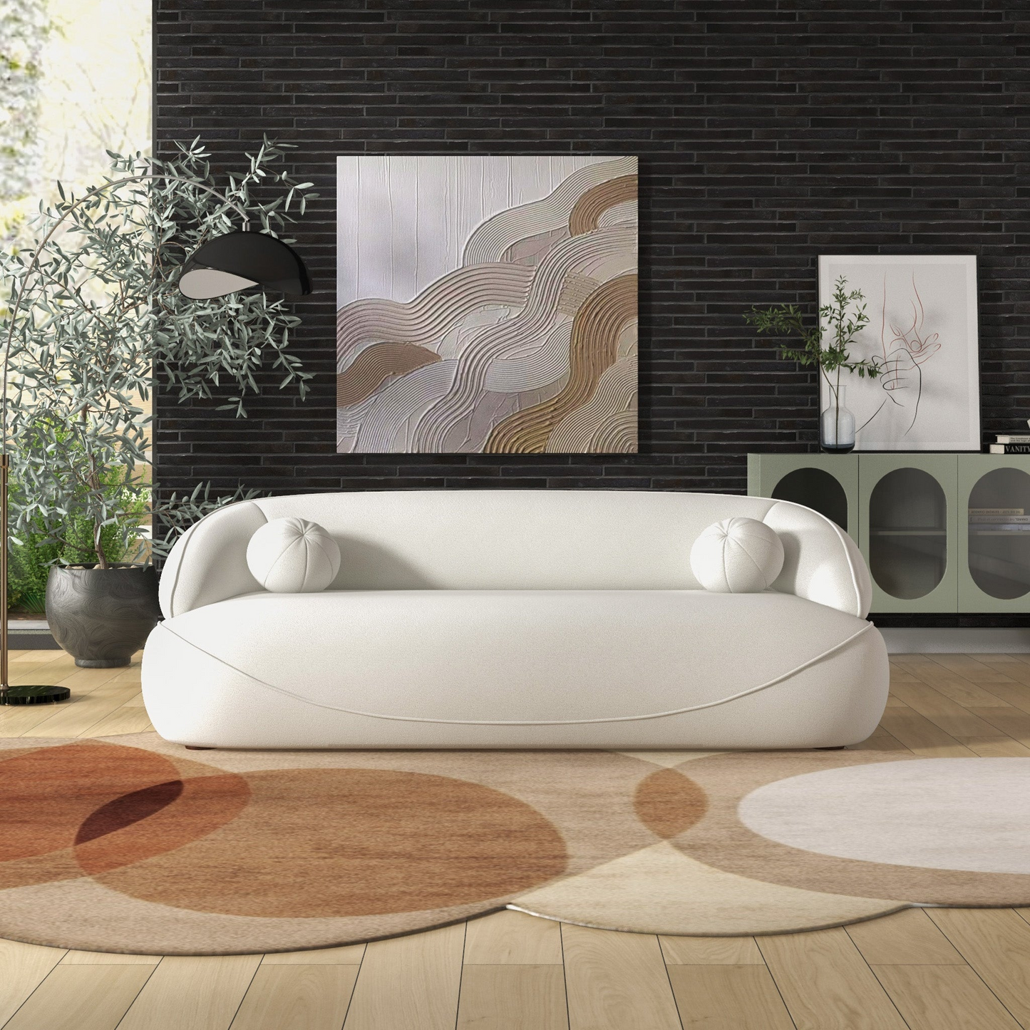 Modern white boucle sofa with rounded arms and two accent pillows