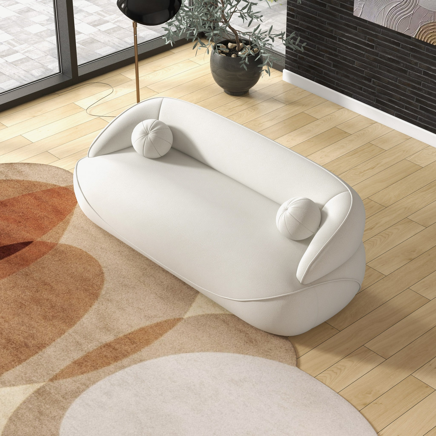 Plush white boucle loveseat with rounded edges and two circular throw pillows Modern small sofa