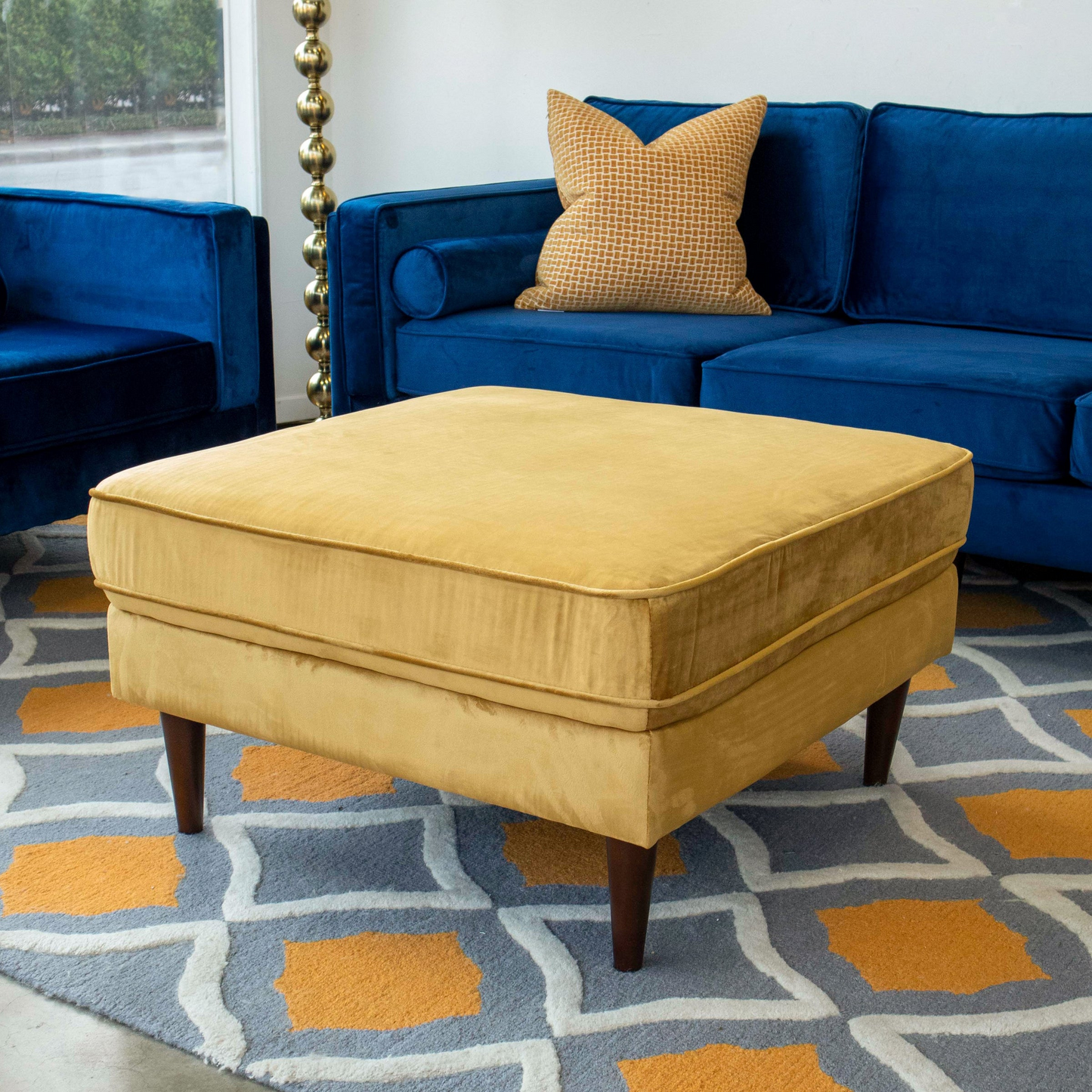 Mustard velvet square ottoman with piped edge and wooden legs