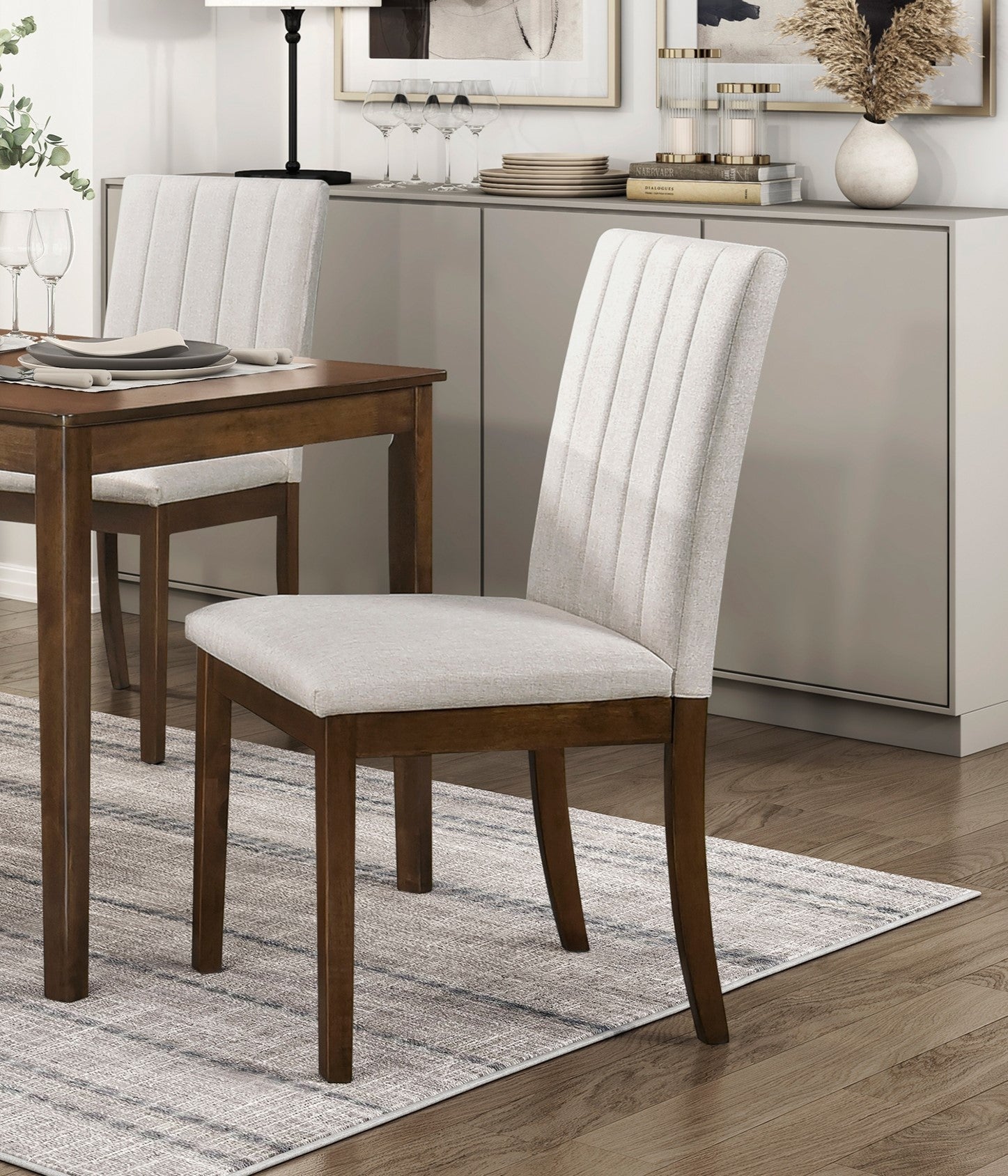 Upholstered dining chair with padded cream seat and vertical stitch detailing on back