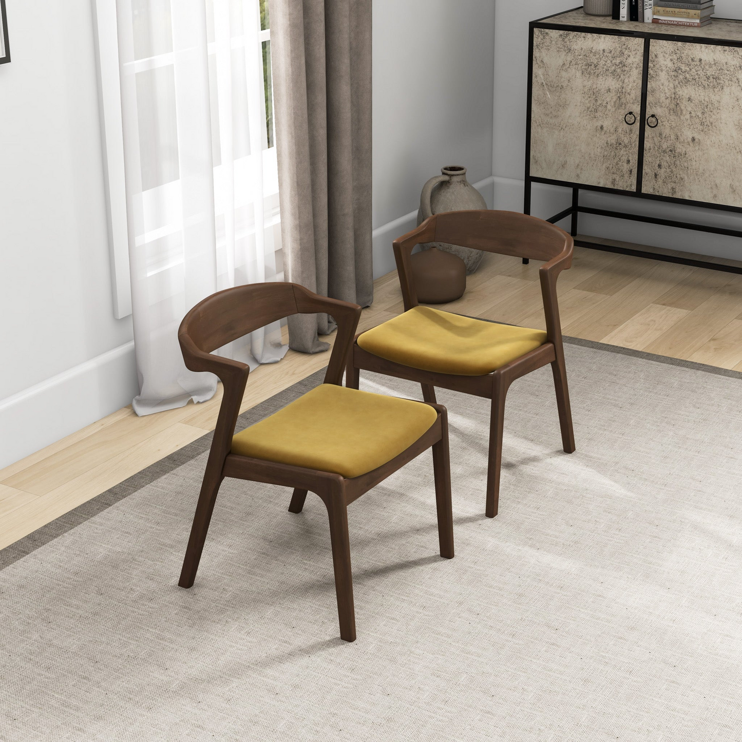 Two modern dark wood chairs with mustard yellow cushions