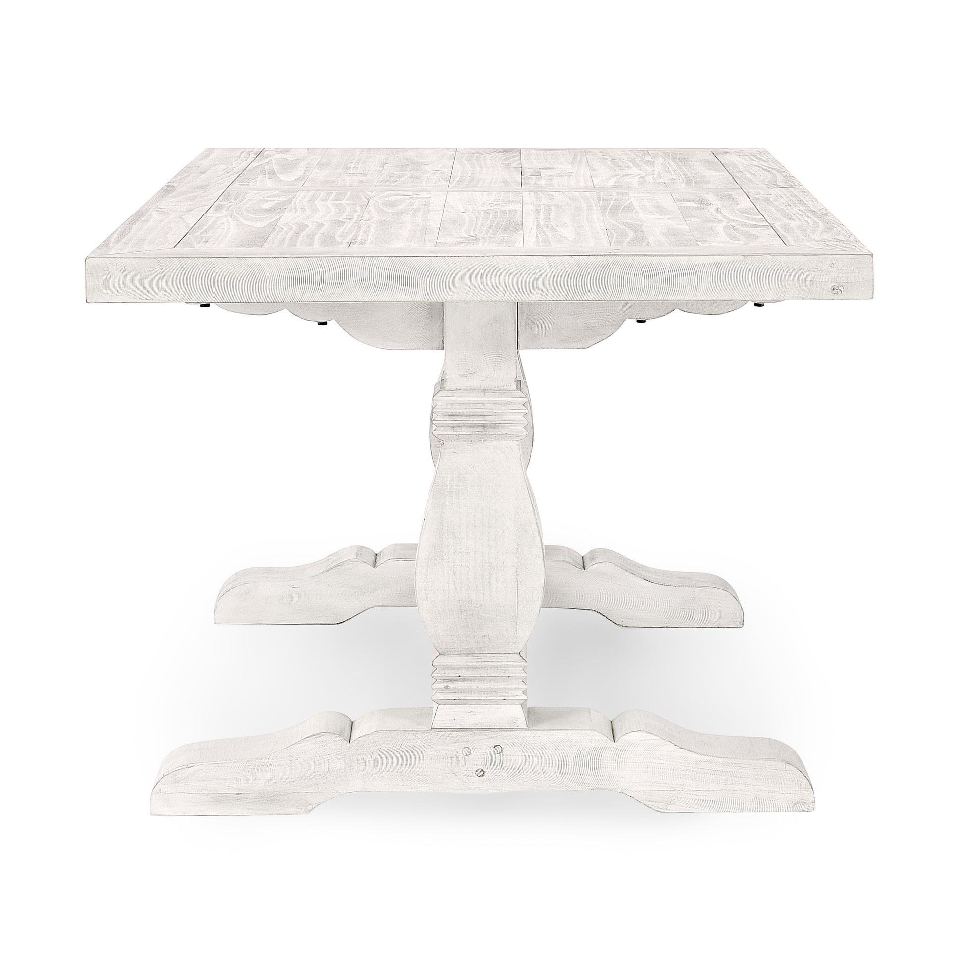 Distressed white wood dining table with a sturdy pedestal base and planked top